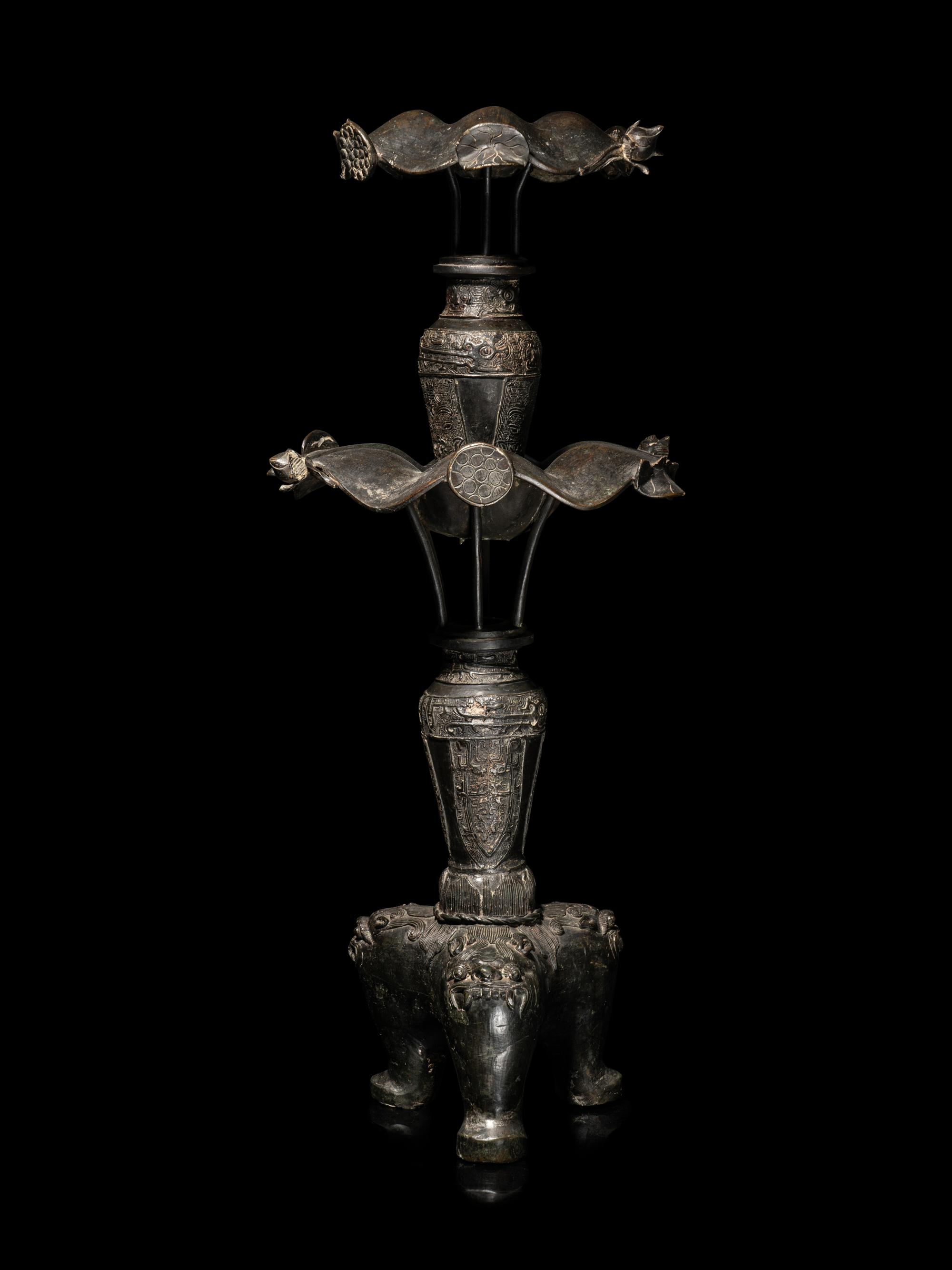 A Large Pair of Bronze Candle Holders