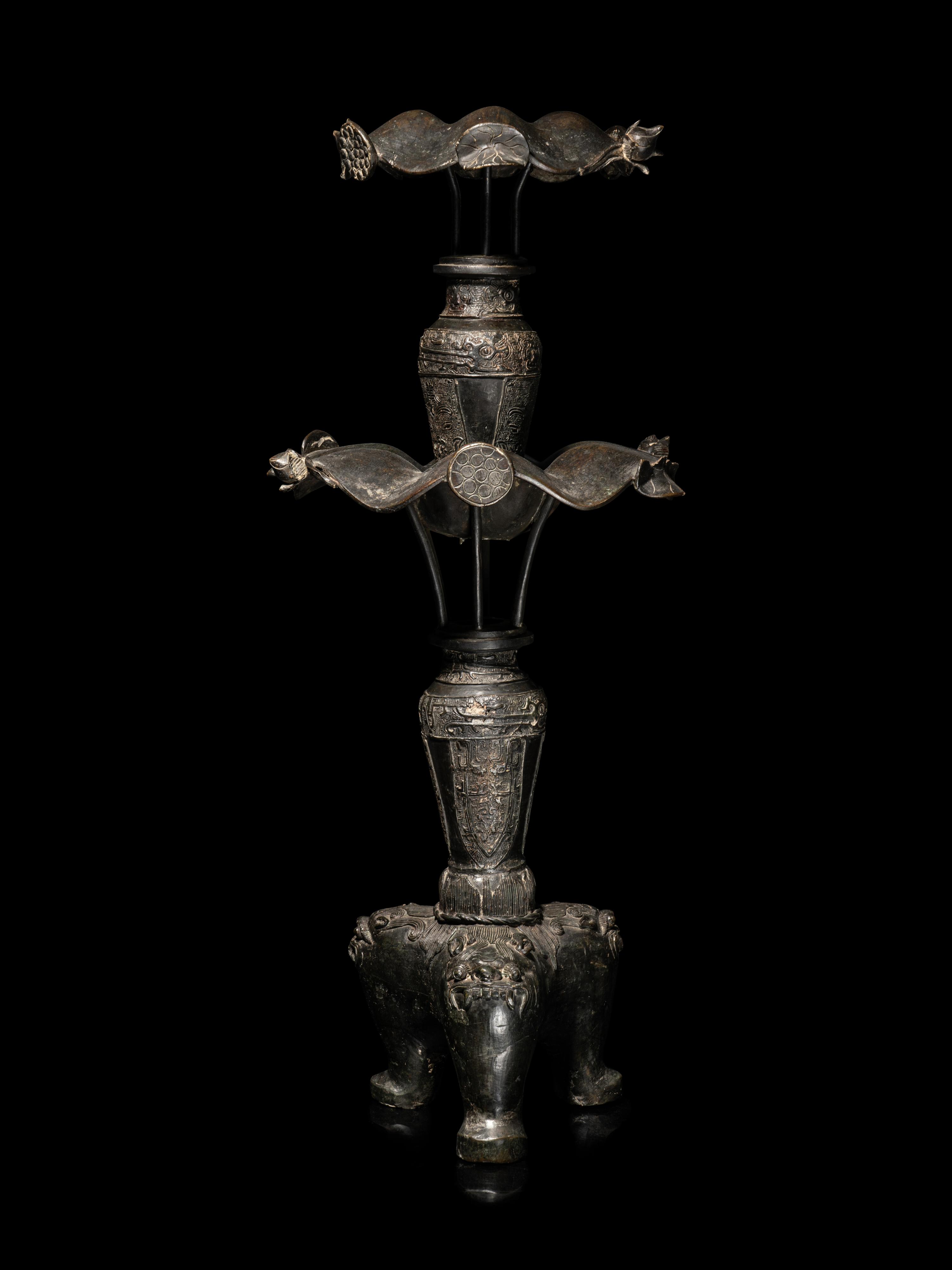 A Large Pair of Bronze Candle Holders