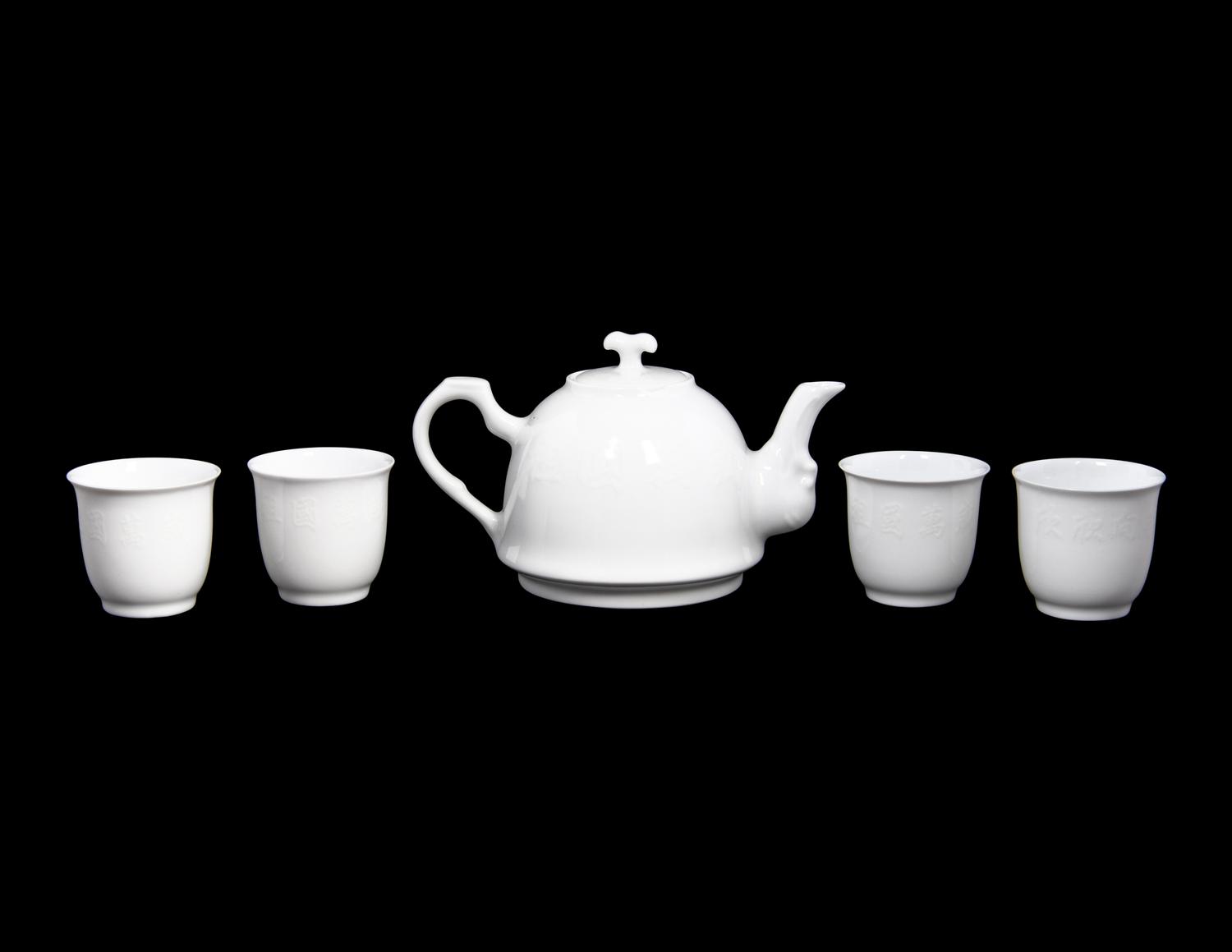 A Set of White Glazed Porcelain Teapot and Tea Cups and A Covered Mug