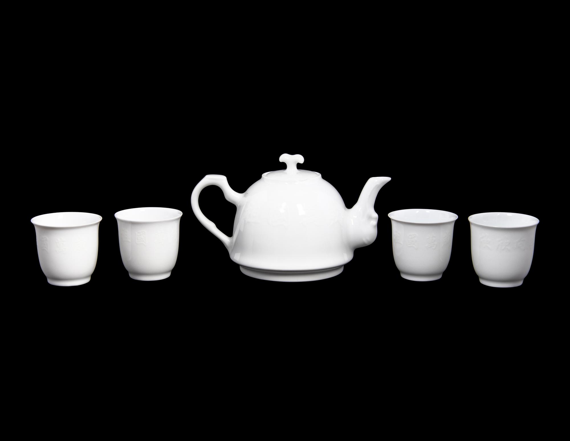 A Set of White Glazed Porcelain Teapot and Tea Cups and A Covered Mug