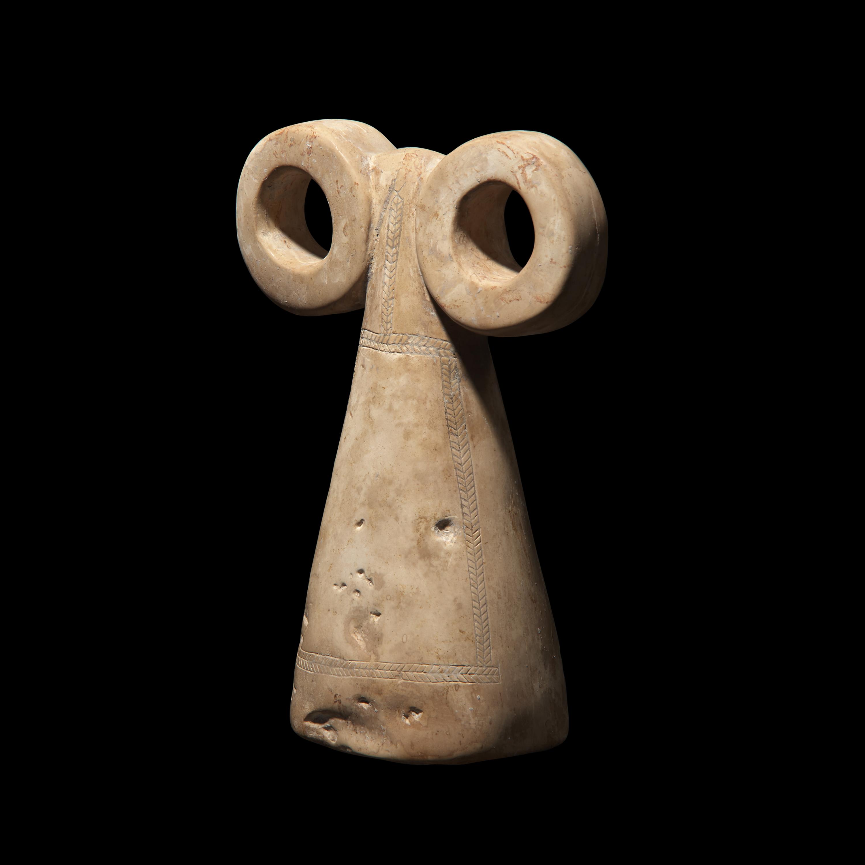 A Mesopotamian Stone Spectacle Idol
