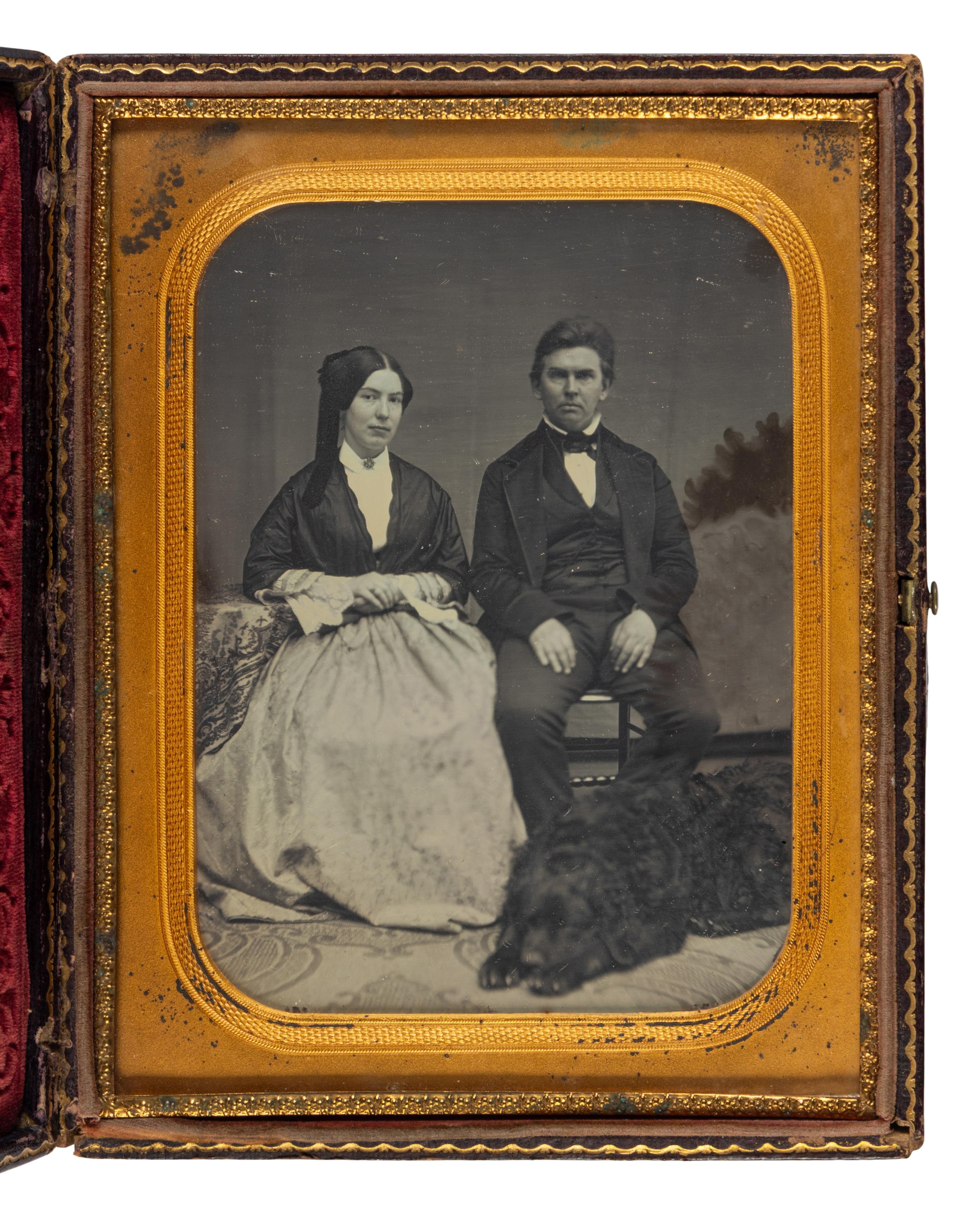 [Early Photography] Half plate daguerreotype of a couple posed with their dog