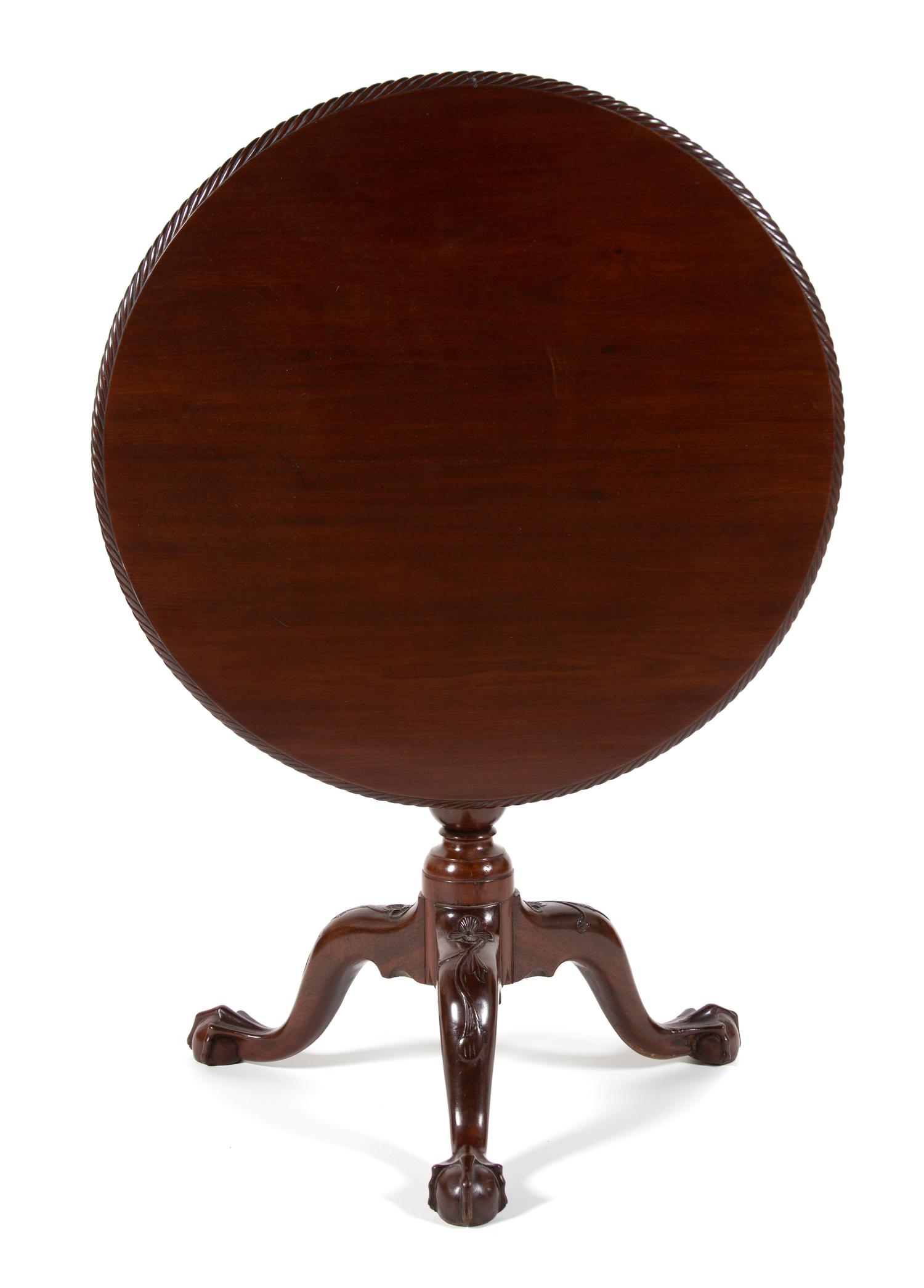 A George II Style Mahogany Tilt Top Table Height 27 1/2 x diameter 30 inches. — LATE 19TH CENTURY