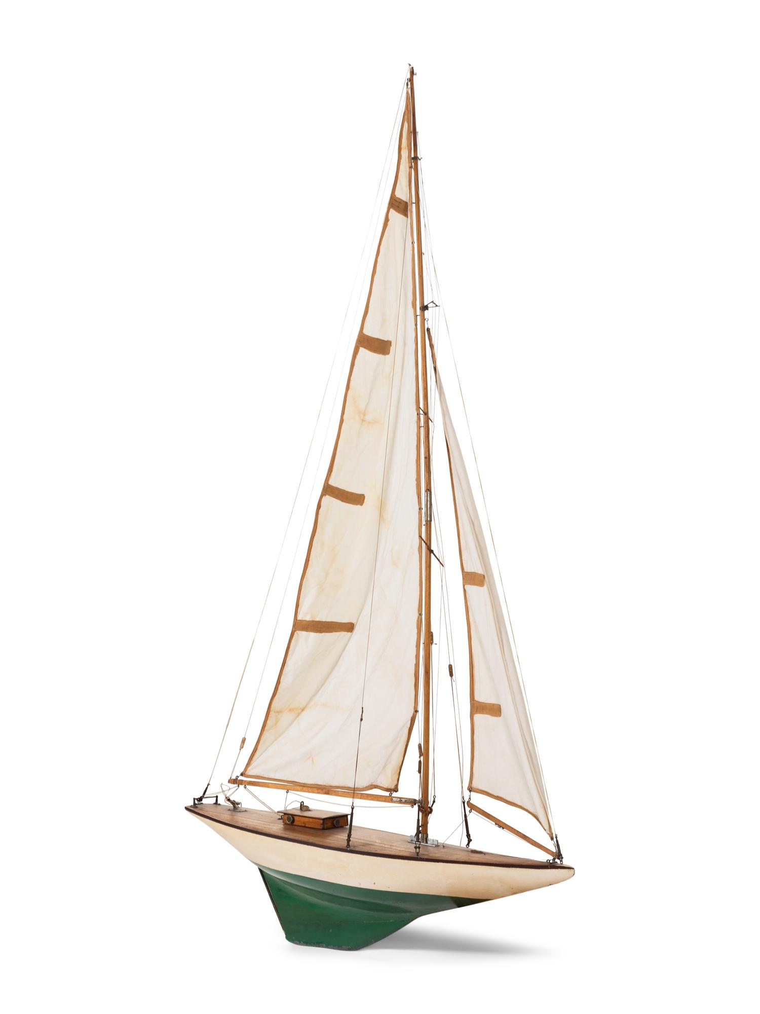 A Carved Wood and Linen Pond Boat