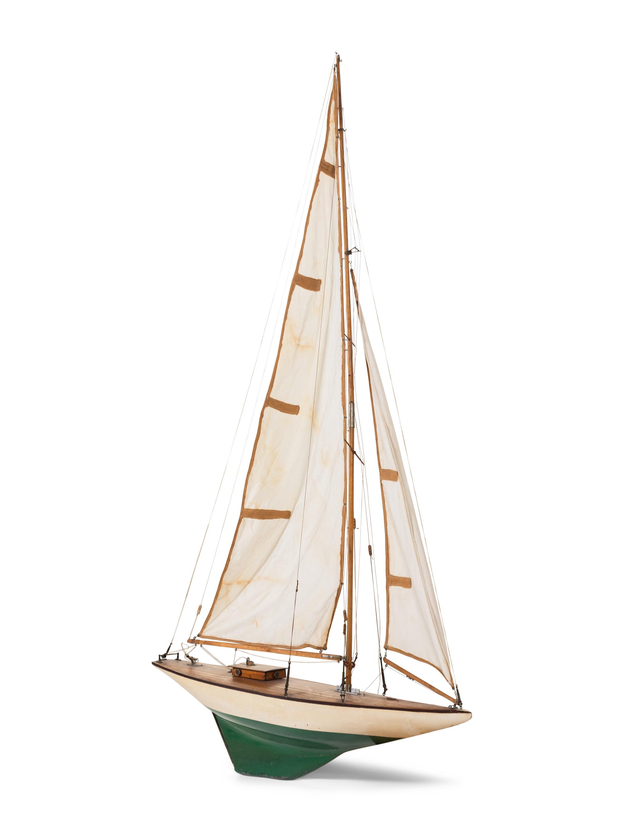 A Carved Wood and Linen Pond Boat