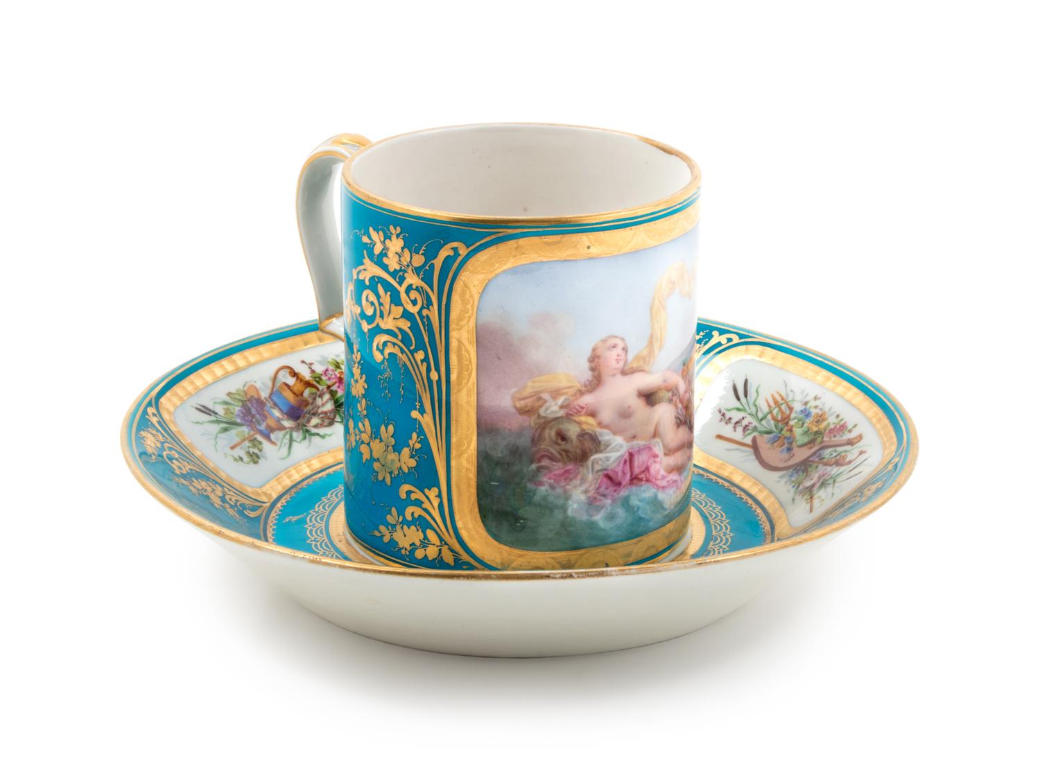 A Sèvres Painted, Parcel Gilt and Celeste Blue-Ground Porcelain Cup and Saucer