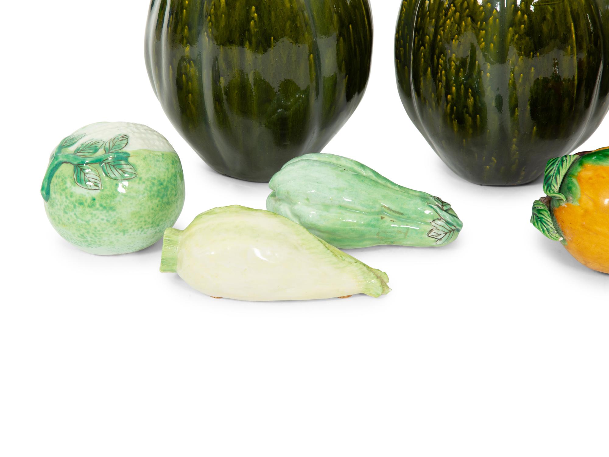 A Collection of Fifteen Miscellaneous Glazed Ceramic Fruits and Vegetables