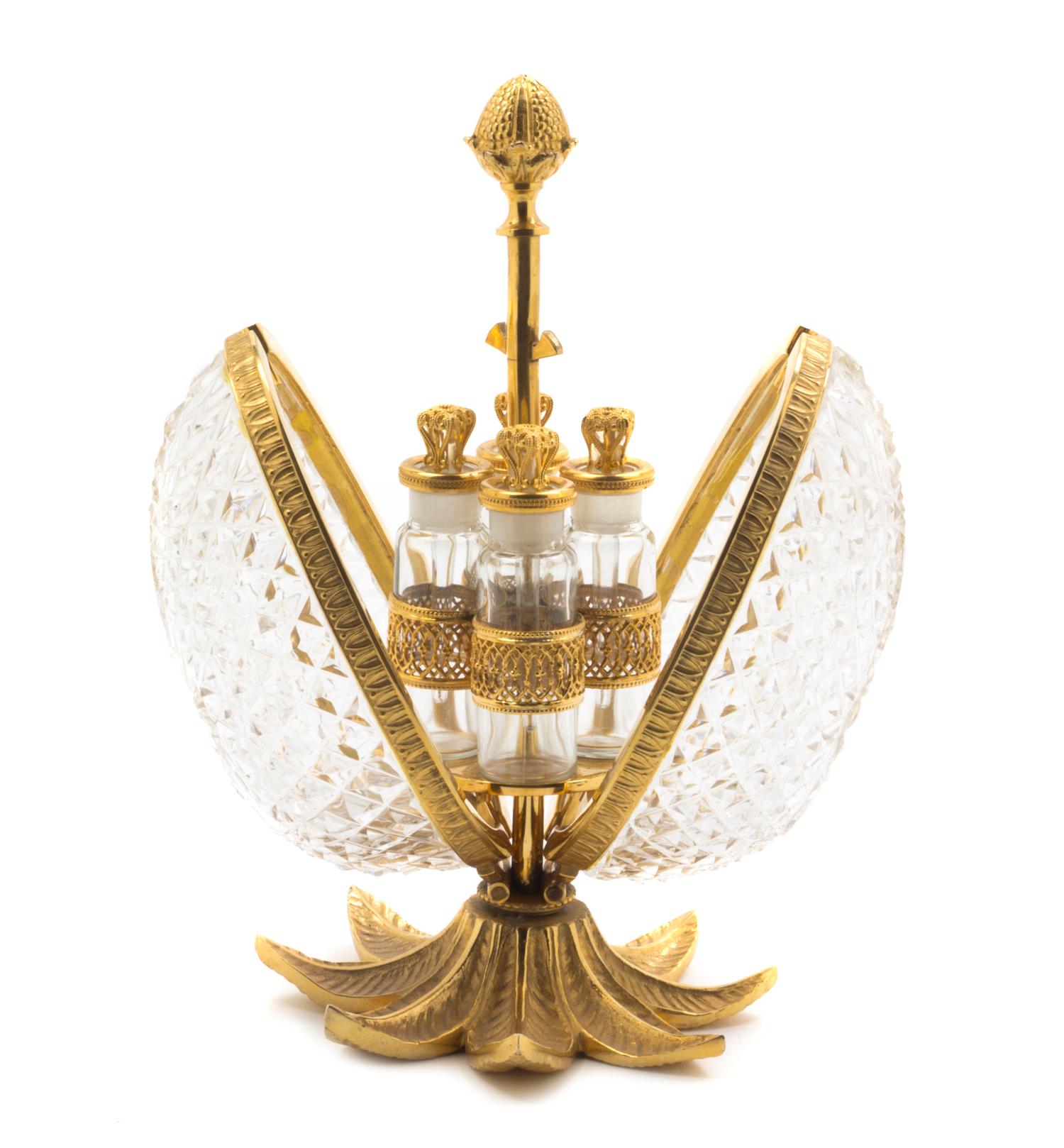 A French Cut Glass and Gilt Bronze Perfume Set, Height 8 1/4 inches.