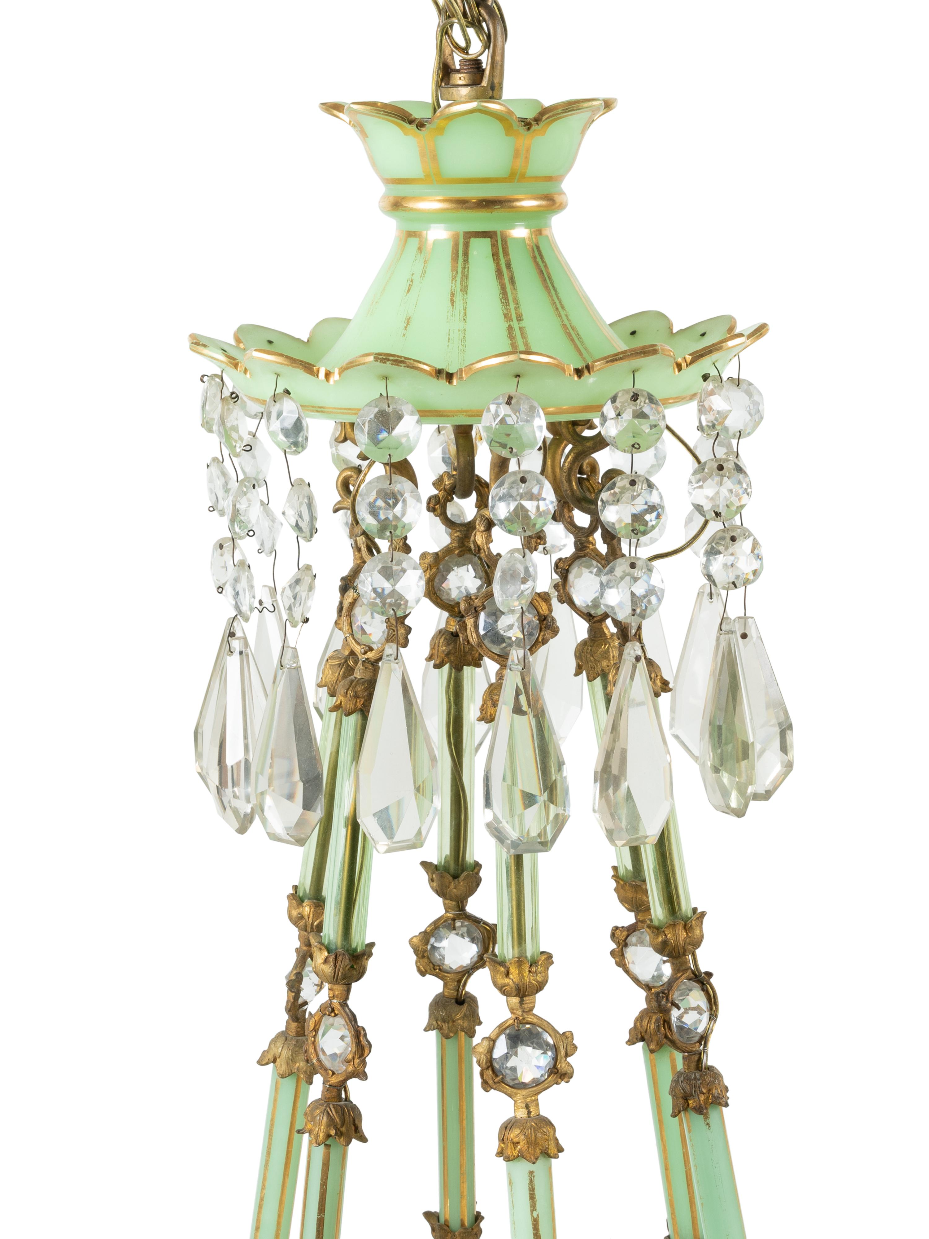 A French Opaline Glass and Gilt Bronze Twelve-Light Chandelier with Cut Glass Hurricane Shades