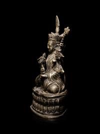 A Sino-Tibetan Silvered Metal Figure of Padmasambhava