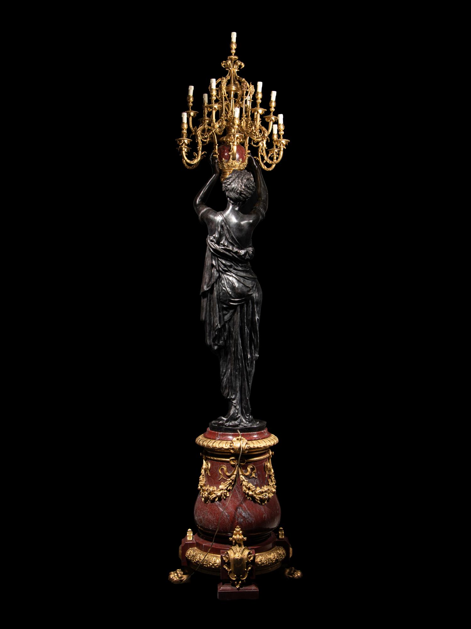 A Pair of Monumental Gilt and Patinated Bronze and Rouge Marble Figural Torchères