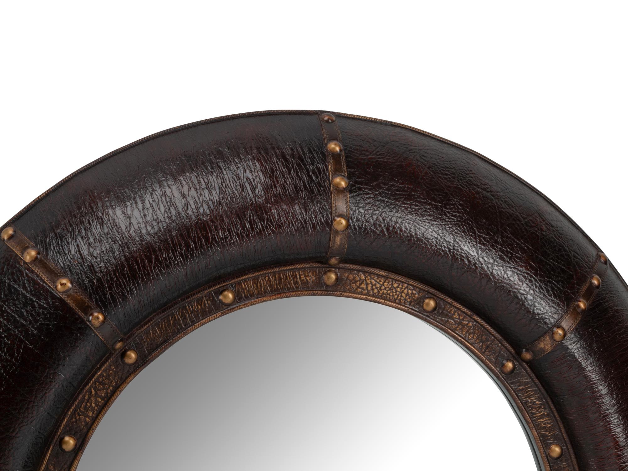 A Pair of Portuguese Style Embossed Leather Circular Mirrors