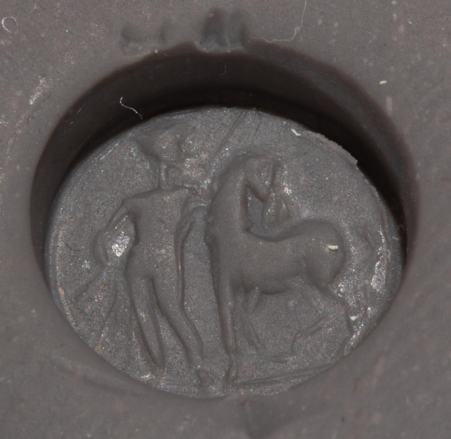 A Roman Carnelian Ring Stone with a Standing Man and Horse, Possibly Castor or Pollux — Set in a gold pendant