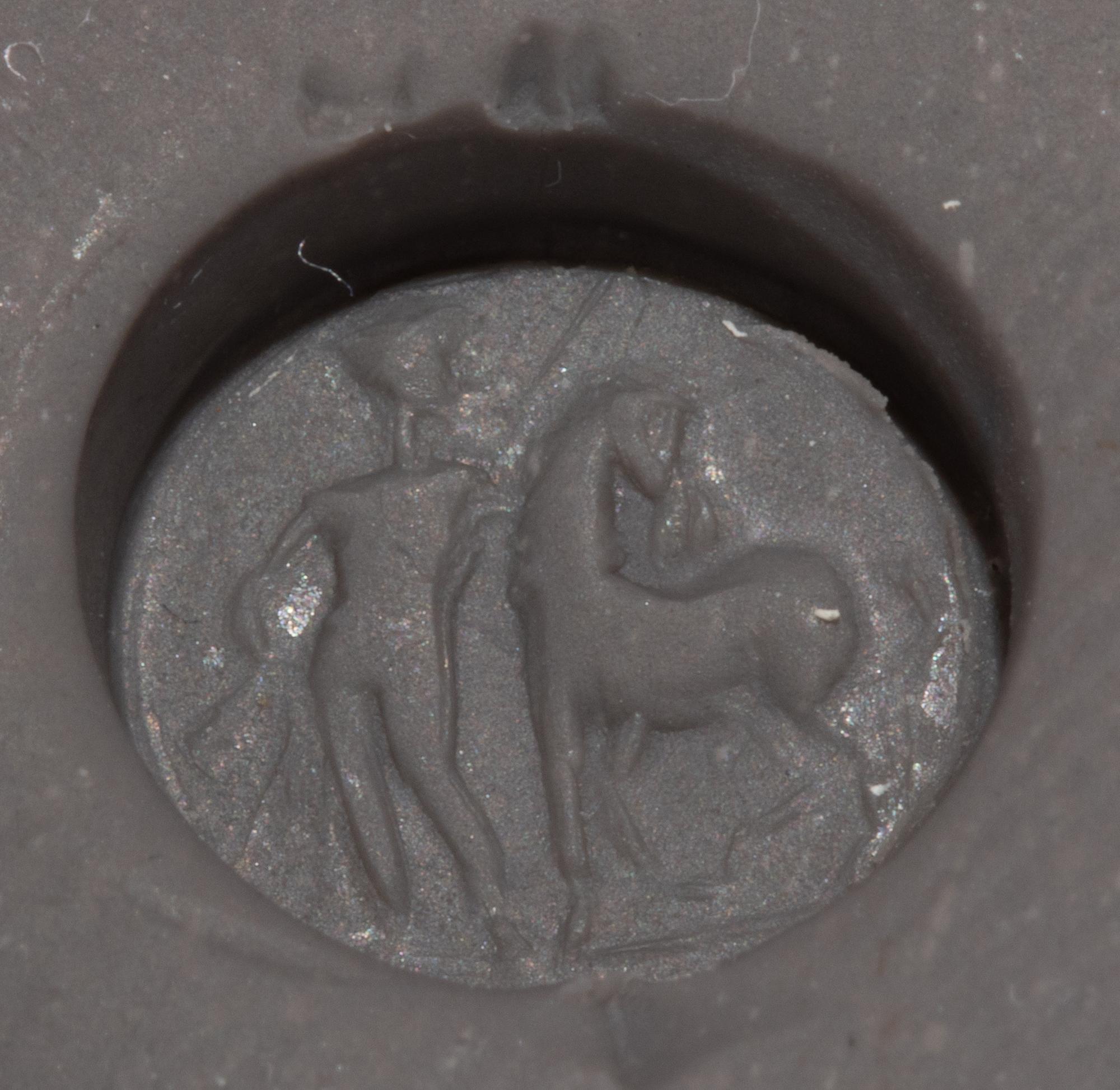 A Roman Carnelian Ring Stone with a Standing Man and Horse, Possibly Castor or Pollux — Set in a gold pendant