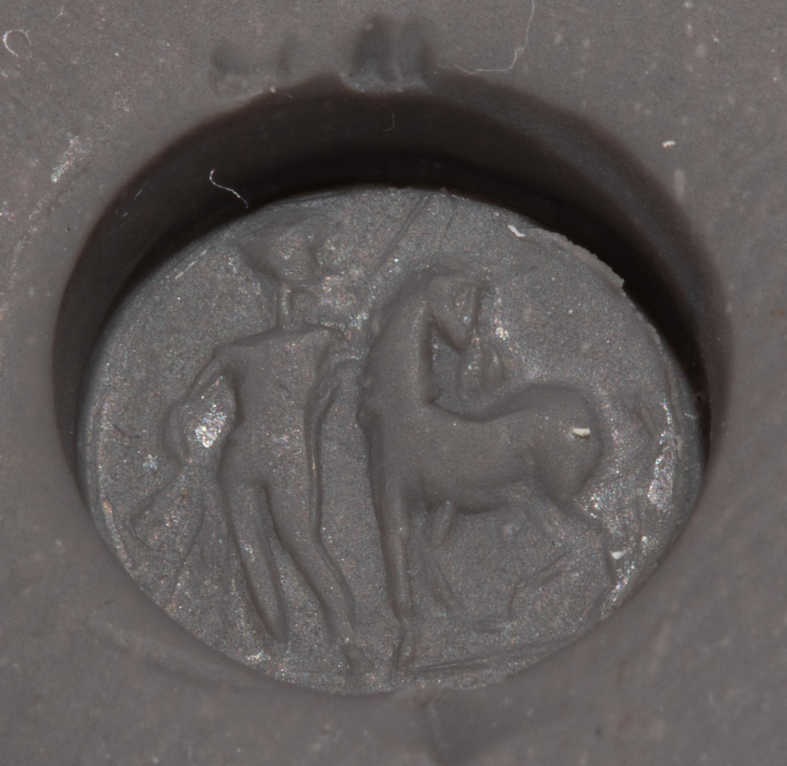 A Roman Carnelian Ring Stone with a Standing Man and Horse, Possibly Castor or Pollux — Set in a gold pendant