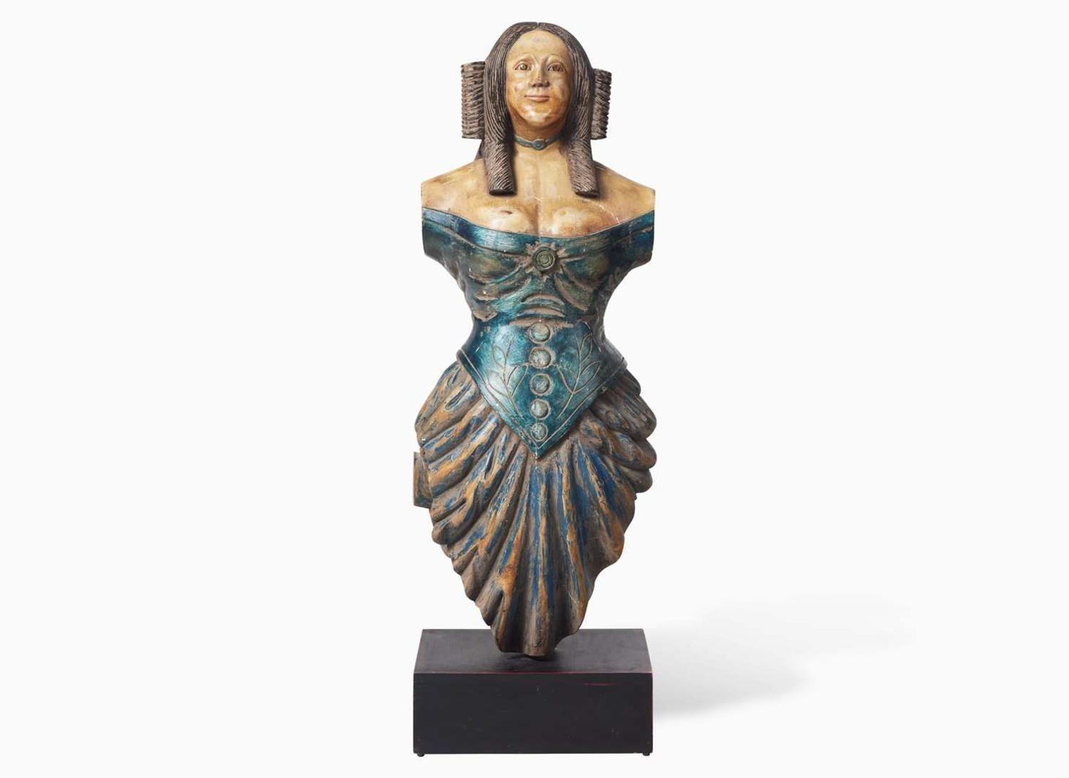 A carved and painted trade figure of a lady, likely 20th century