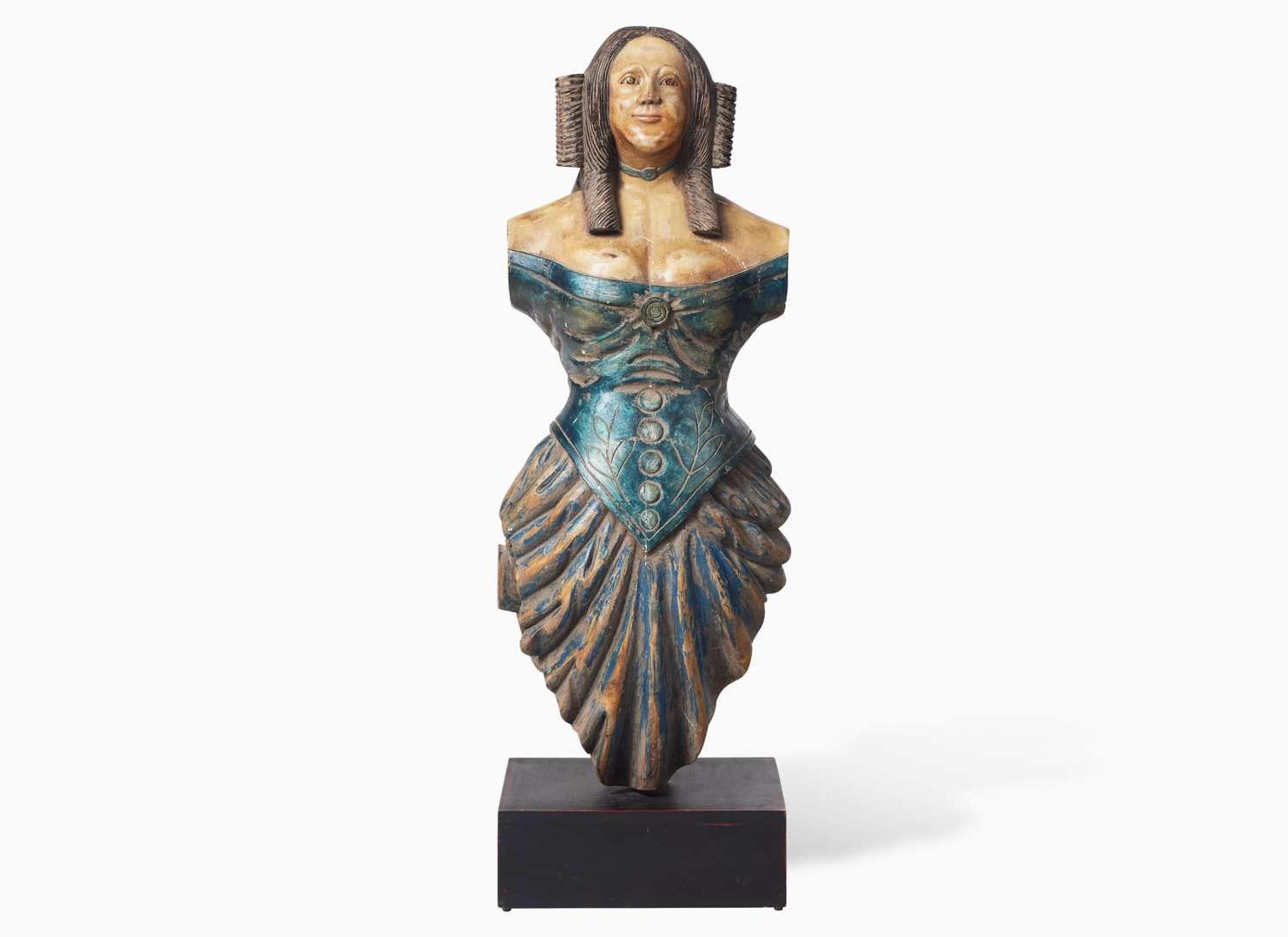 A carved and painted trade figure of a lady, likely 20th century