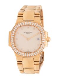 PATEK PHILIPPE, REF. 4700 18K YELLOW GOLD AND DIAMOND 'NAUTILUS' WATCH