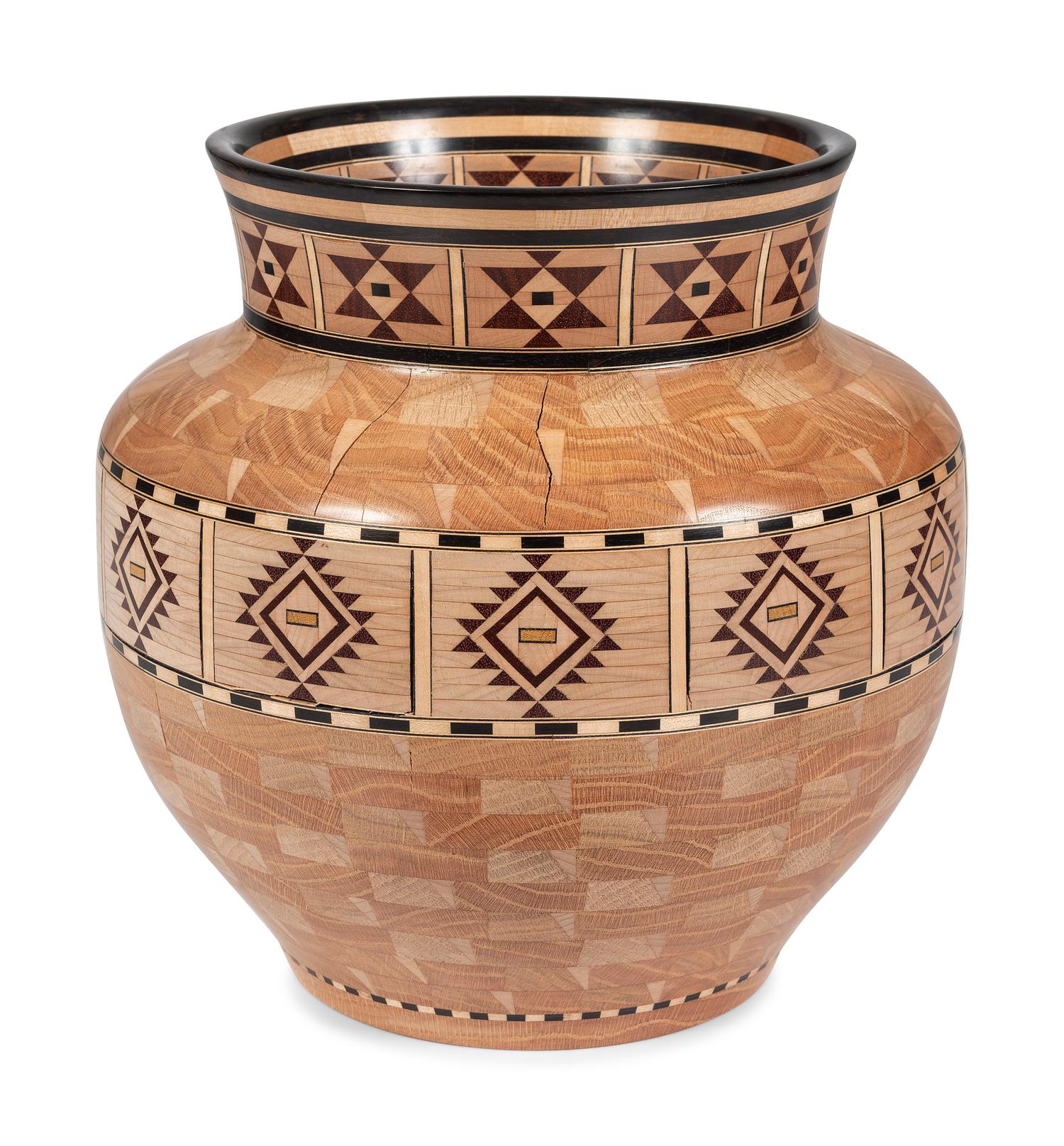 A Turned and Segmented Wood Vase in the style of Ray Allen