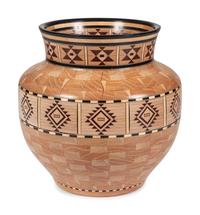 A Turned and Segmented Wood Vase in the style of Ray Allen