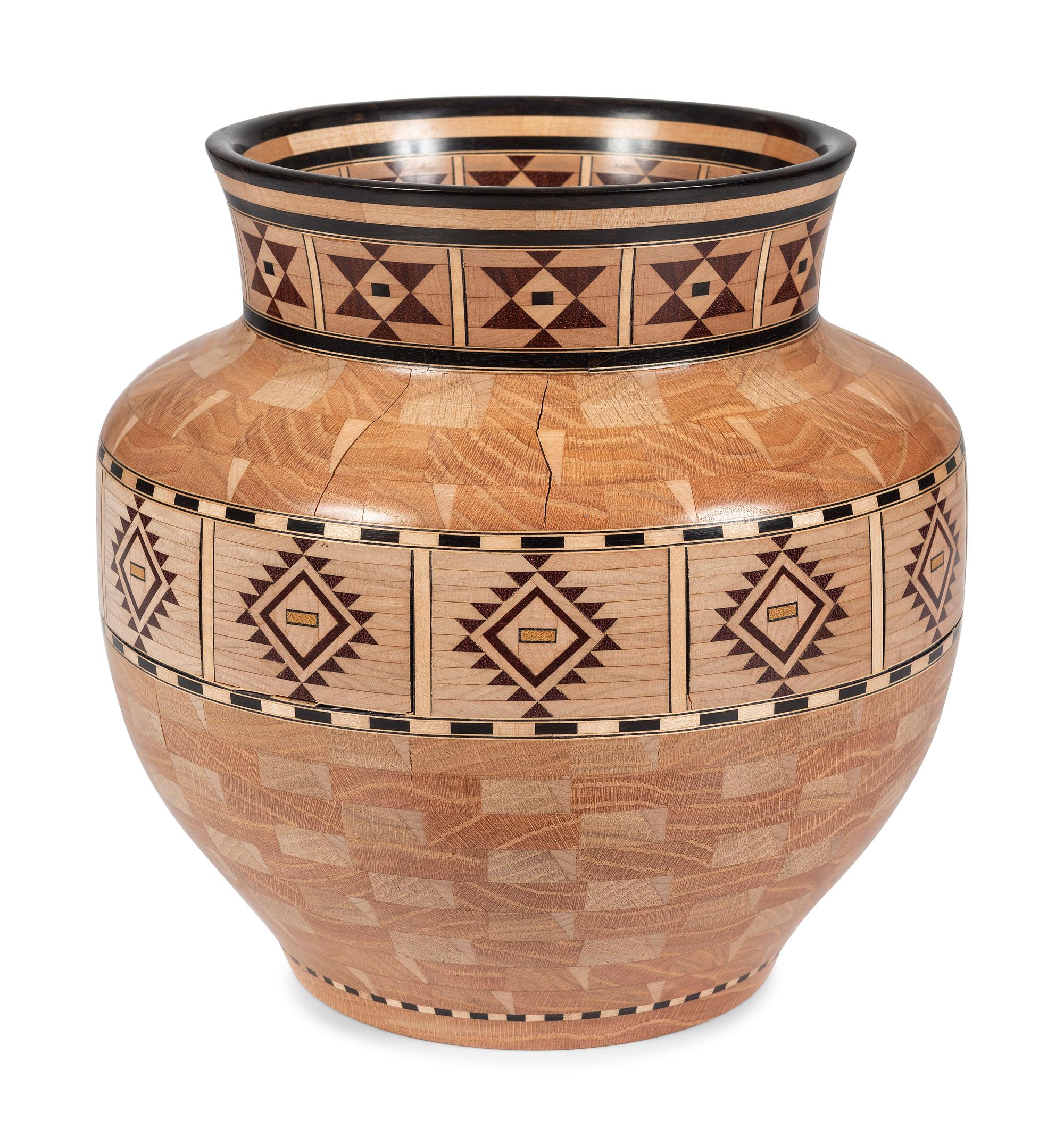 A Turned and Segmented Wood Vase in the style of Ray Allen