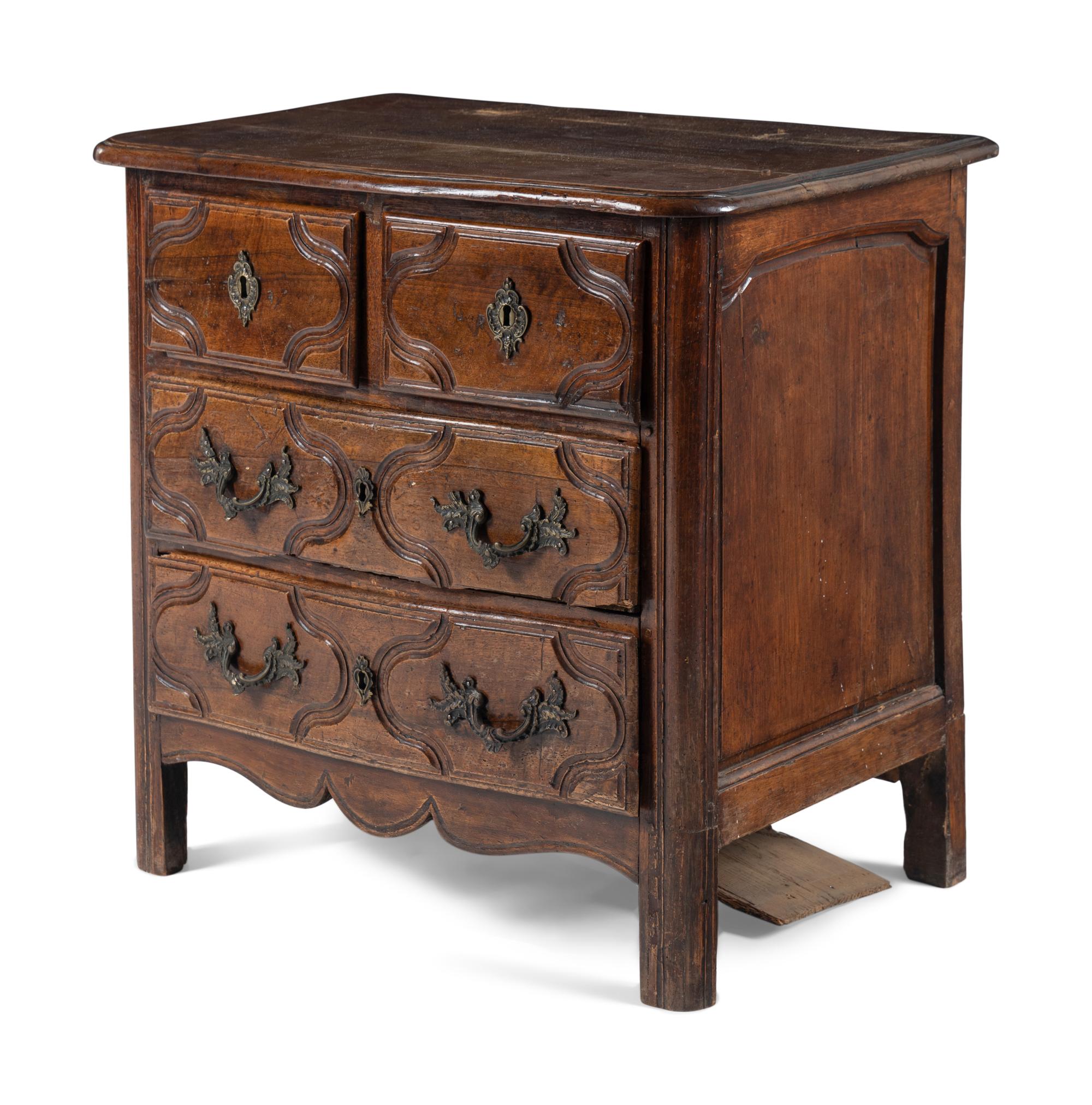 A Louis XV/XVI Provincial Walnut Chest of Drawers
