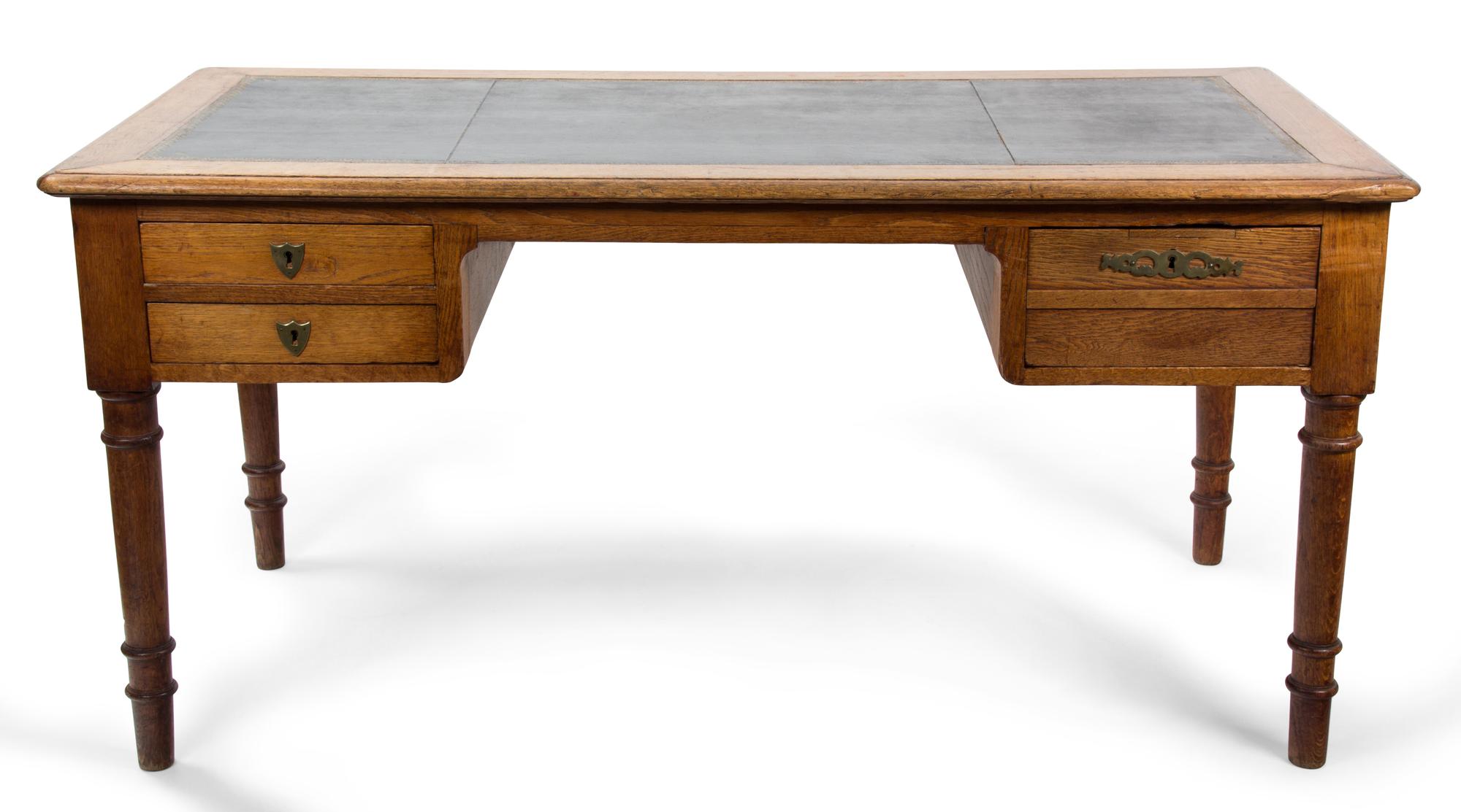 An American Oak Writing Desk Height 30 x width 62 1/2 x depth 31 inches. — 20TH CENTURY