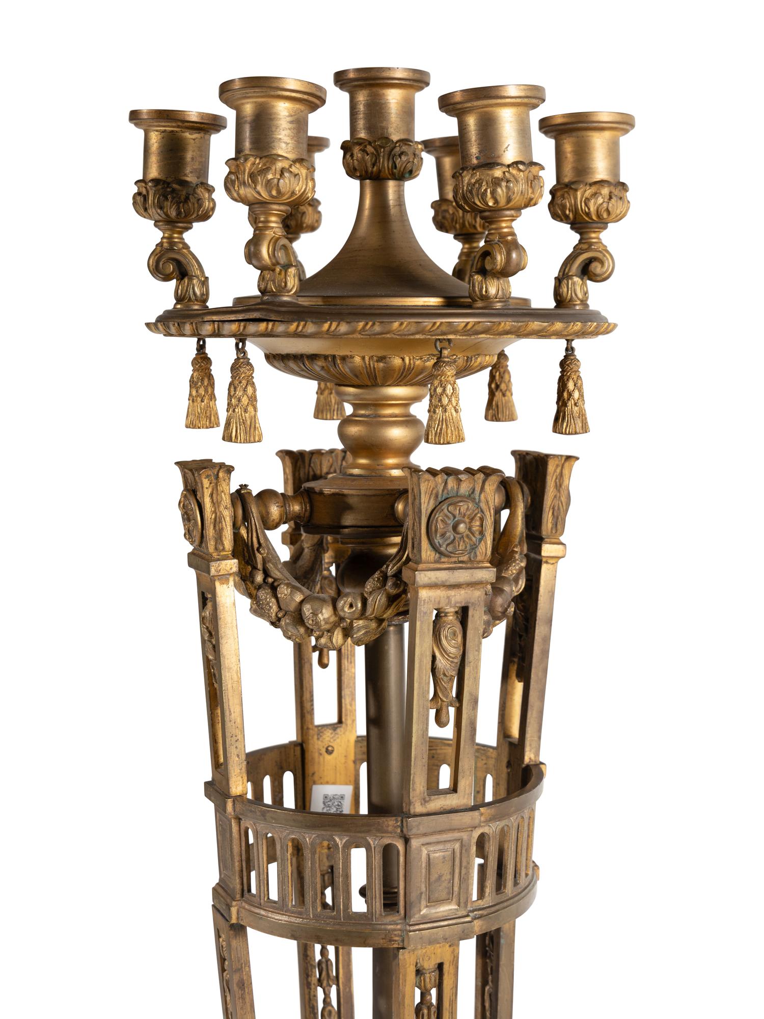 A Pair of Neoclassical Gilt Bronze Seven-Light Candelabra