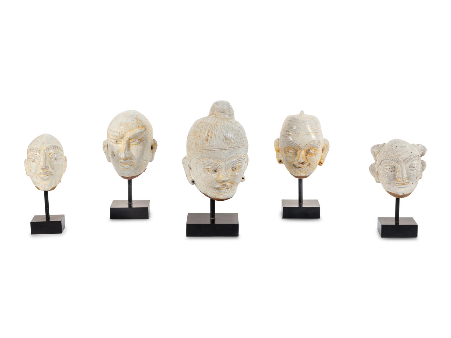 Five Glazed Earthenware Deity Heads