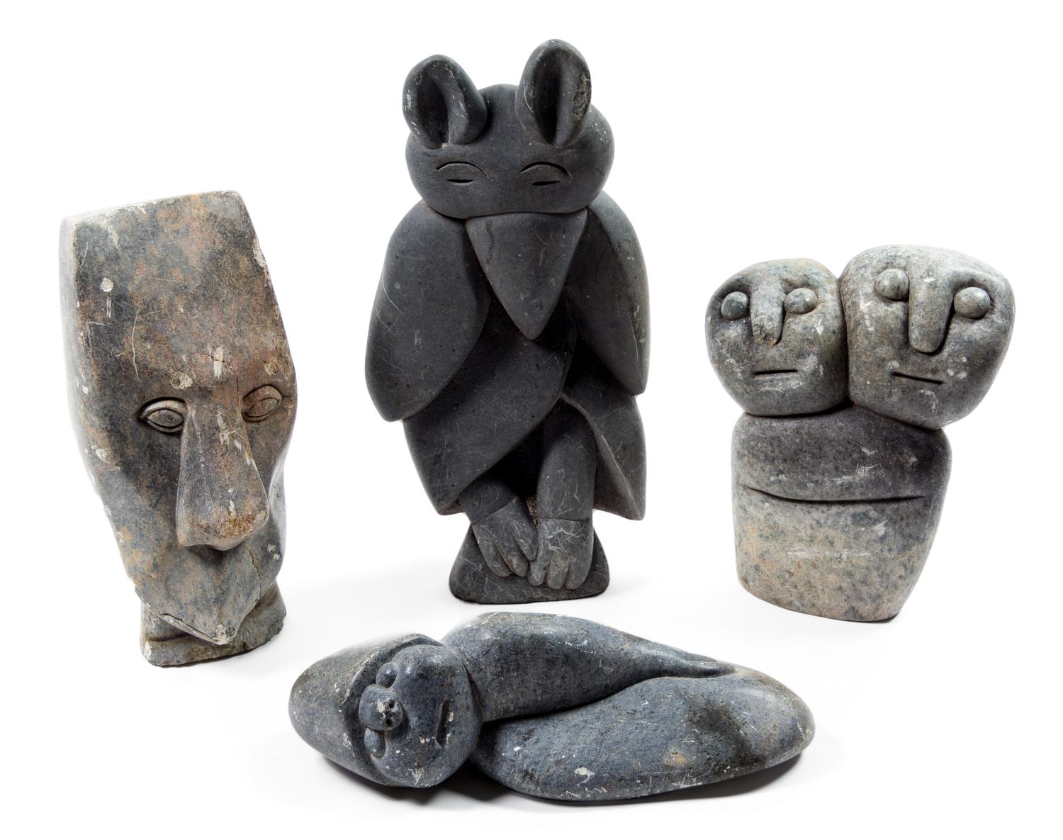 A Group of Four Carved Stone Garden Figures Height of tallest 13 inches.