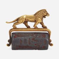 A Babylonian carved hematite cylindrical seal second millenium B.C.