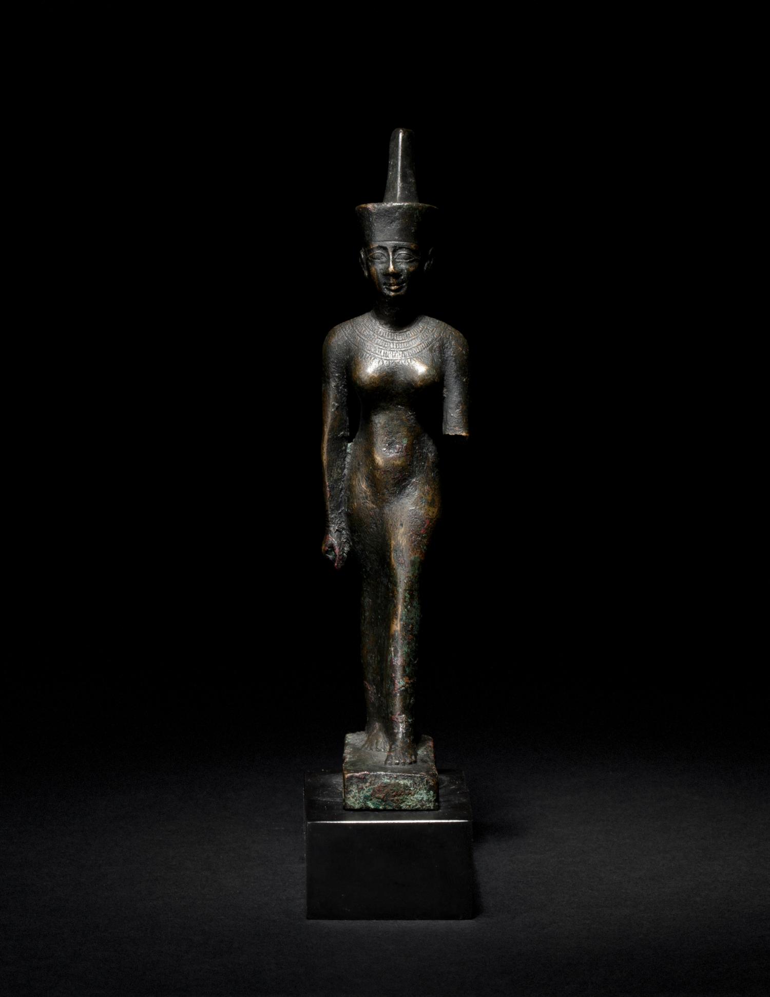 An Egyptian Bronze Striding Neith