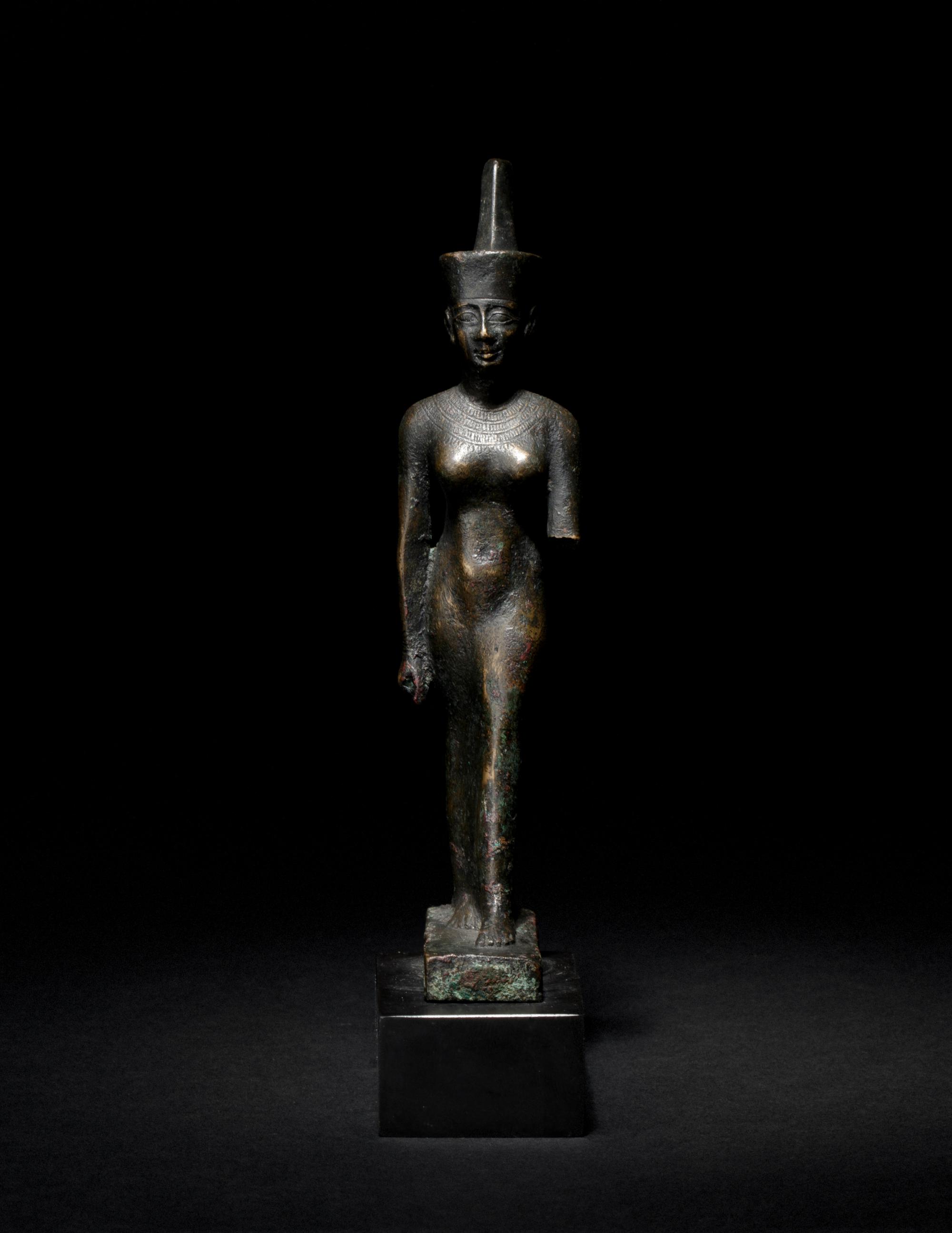An Egyptian Bronze Striding Neith