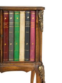 A Louis XV Style Walnut and Leather Faux Book-Front Cabinet