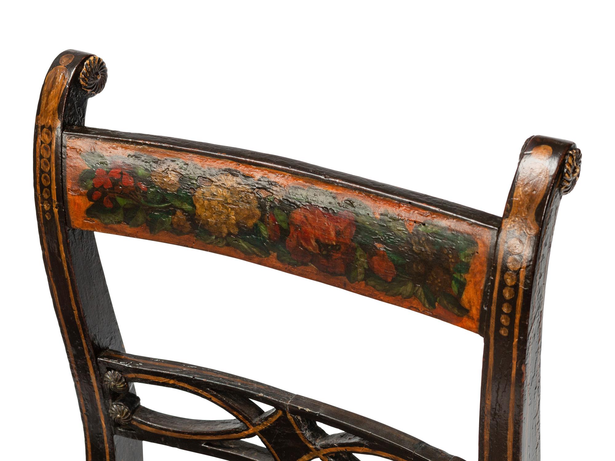 A Set of Six Regency Stencil Decorated and Parcel Gilt Ebonized Dining Chairs