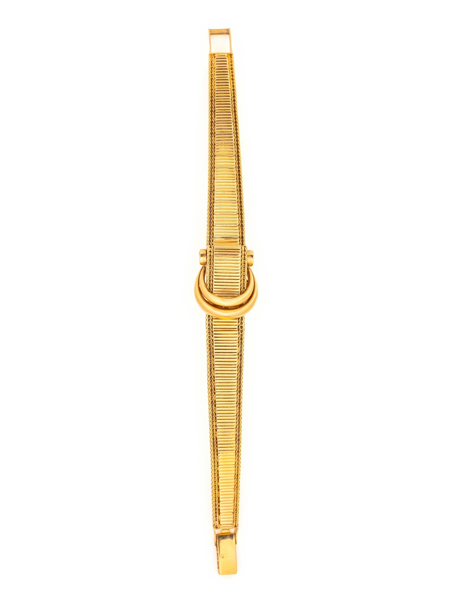MOVADO, 18K YELLOW GOLD SURPRISE WATCH