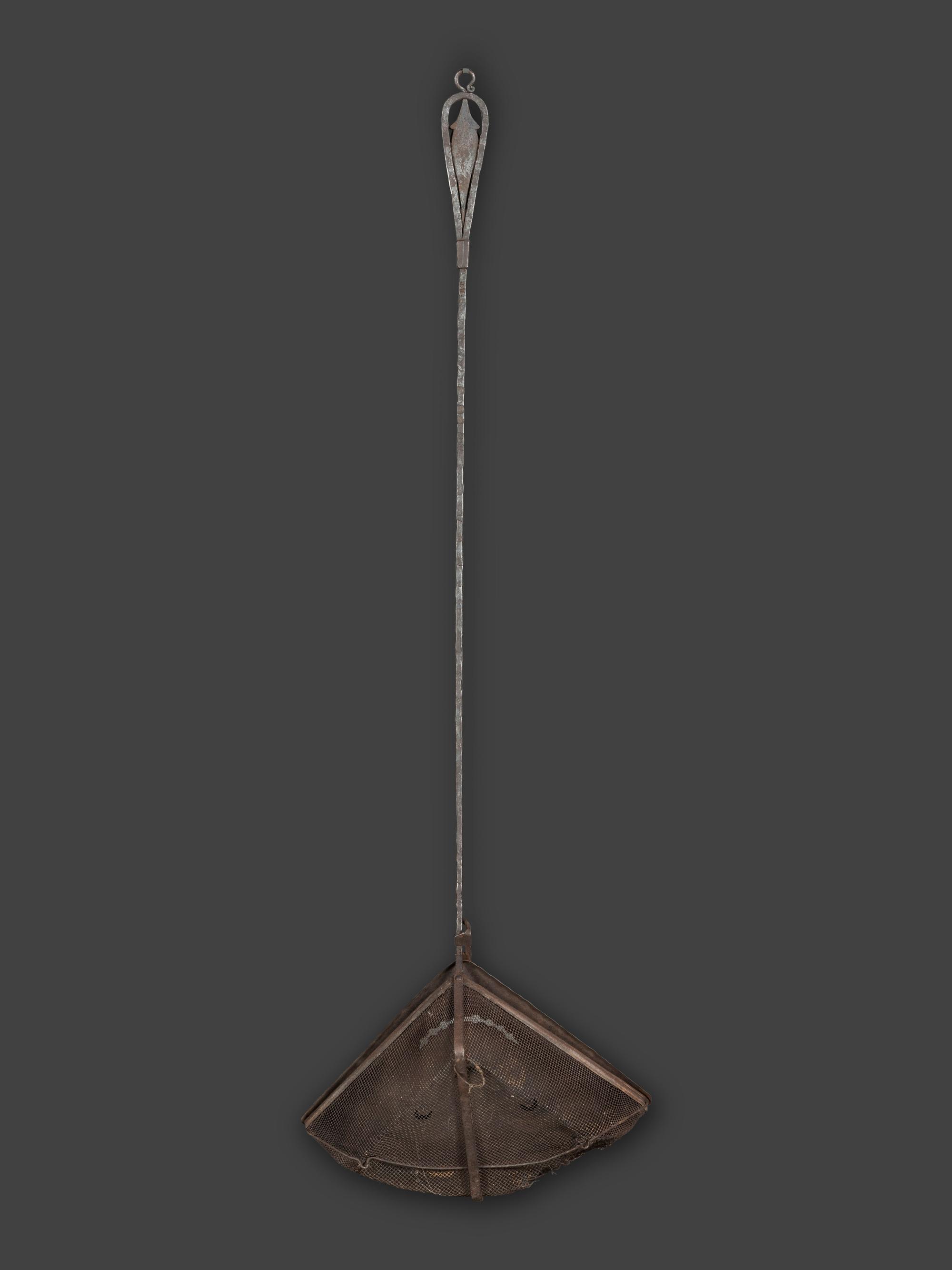 A Forged and Hammered Iron Figural Chestnut Roaster