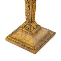 A Pair of Continental Gilt Iron Candlesticks