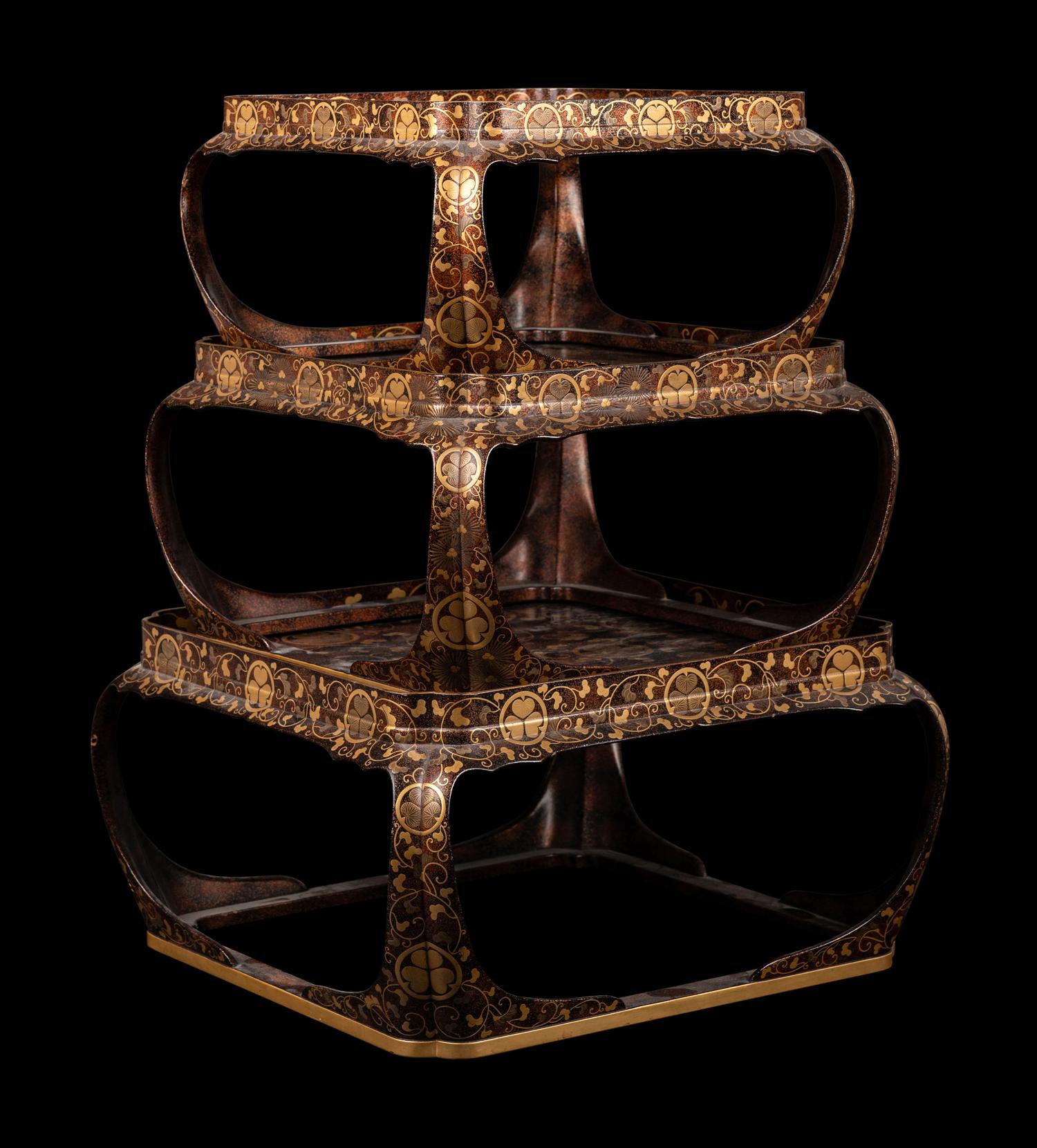 A Set of Three Japanese Gilt Decorated Lacquer Nesting Tables