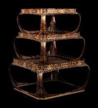 A Set of Three Japanese Gilt Decorated Lacquer Nesting Tables