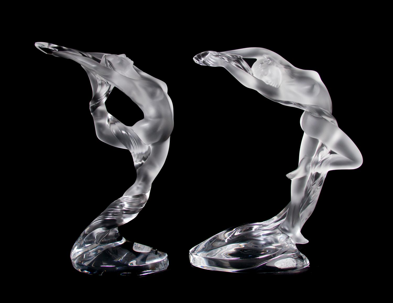 A Pair of Lalique Molded and Frosted Glass Figures, Height 10 inches.