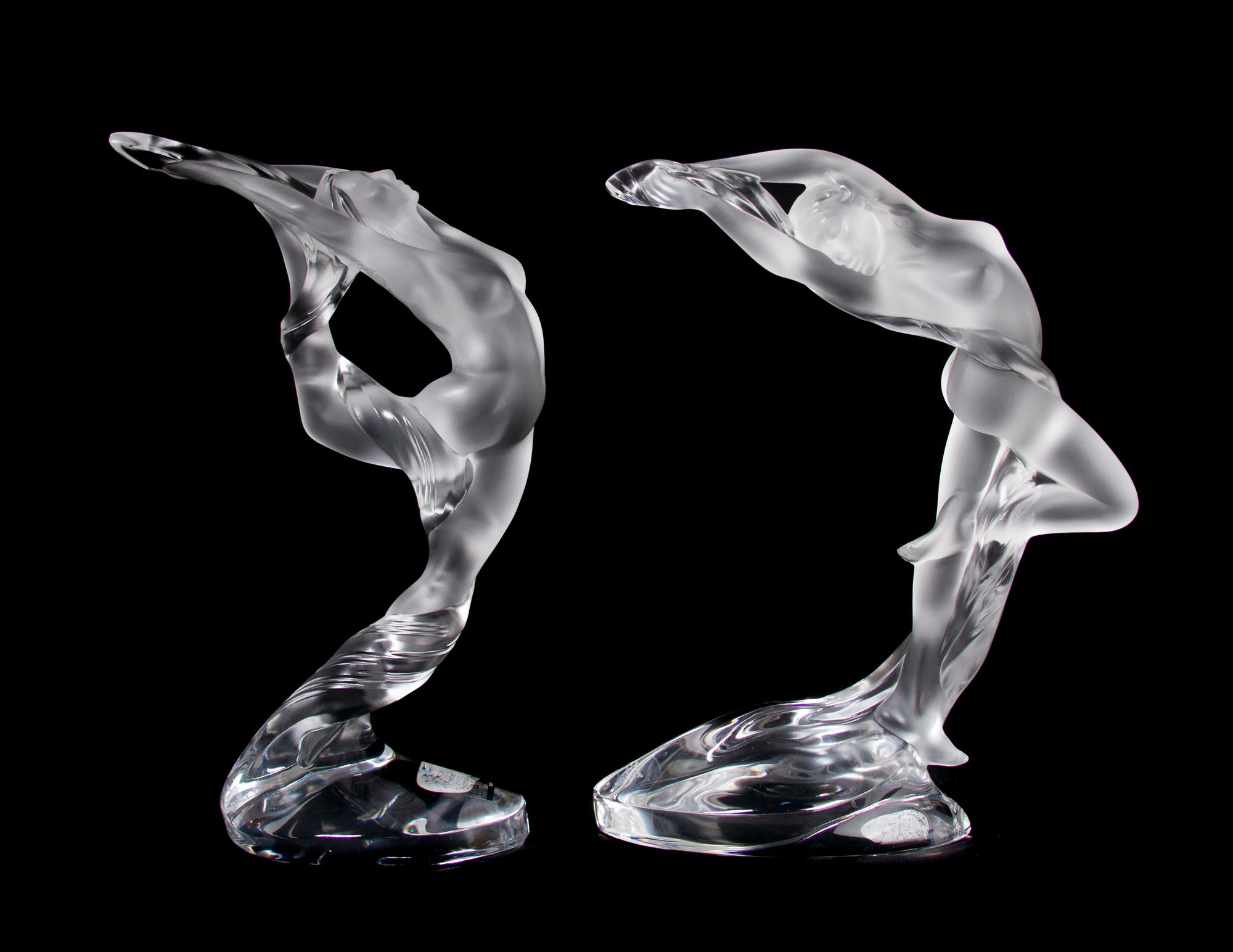 A Pair of Lalique Molded and Frosted Glass Figures, Height 10 inches.
