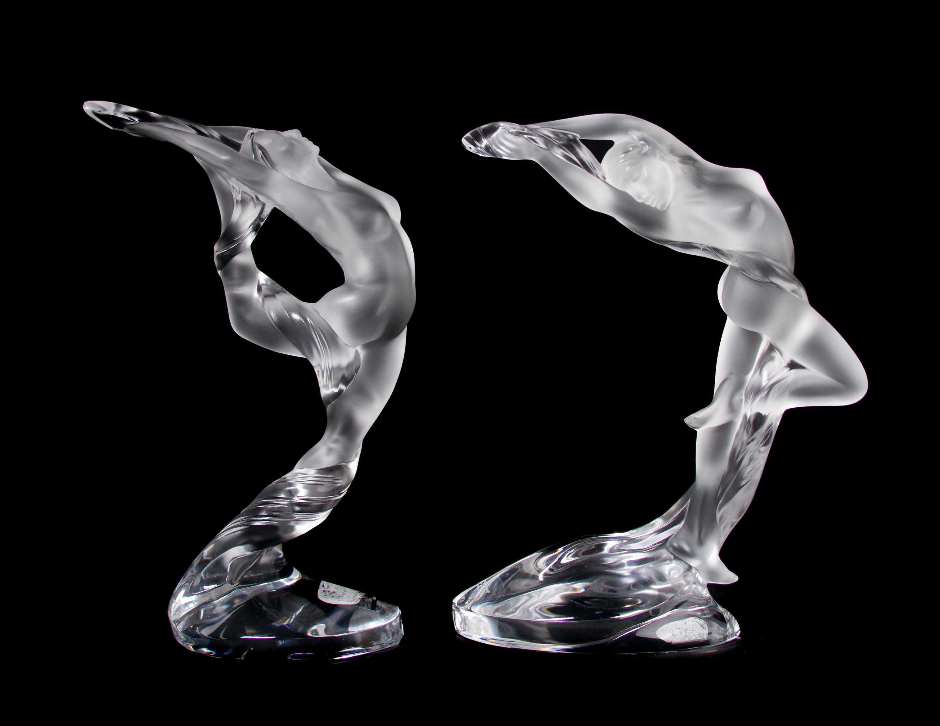 A Pair of Lalique Molded and Frosted Glass Figures, Height 10 inches.