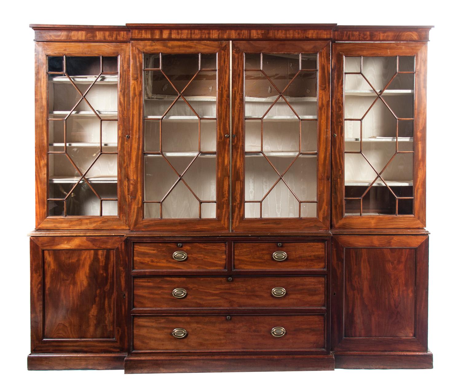 A George III Style Mahogany Breakfront Bookcase, Height 82 x width 96 x depth 16 inches.