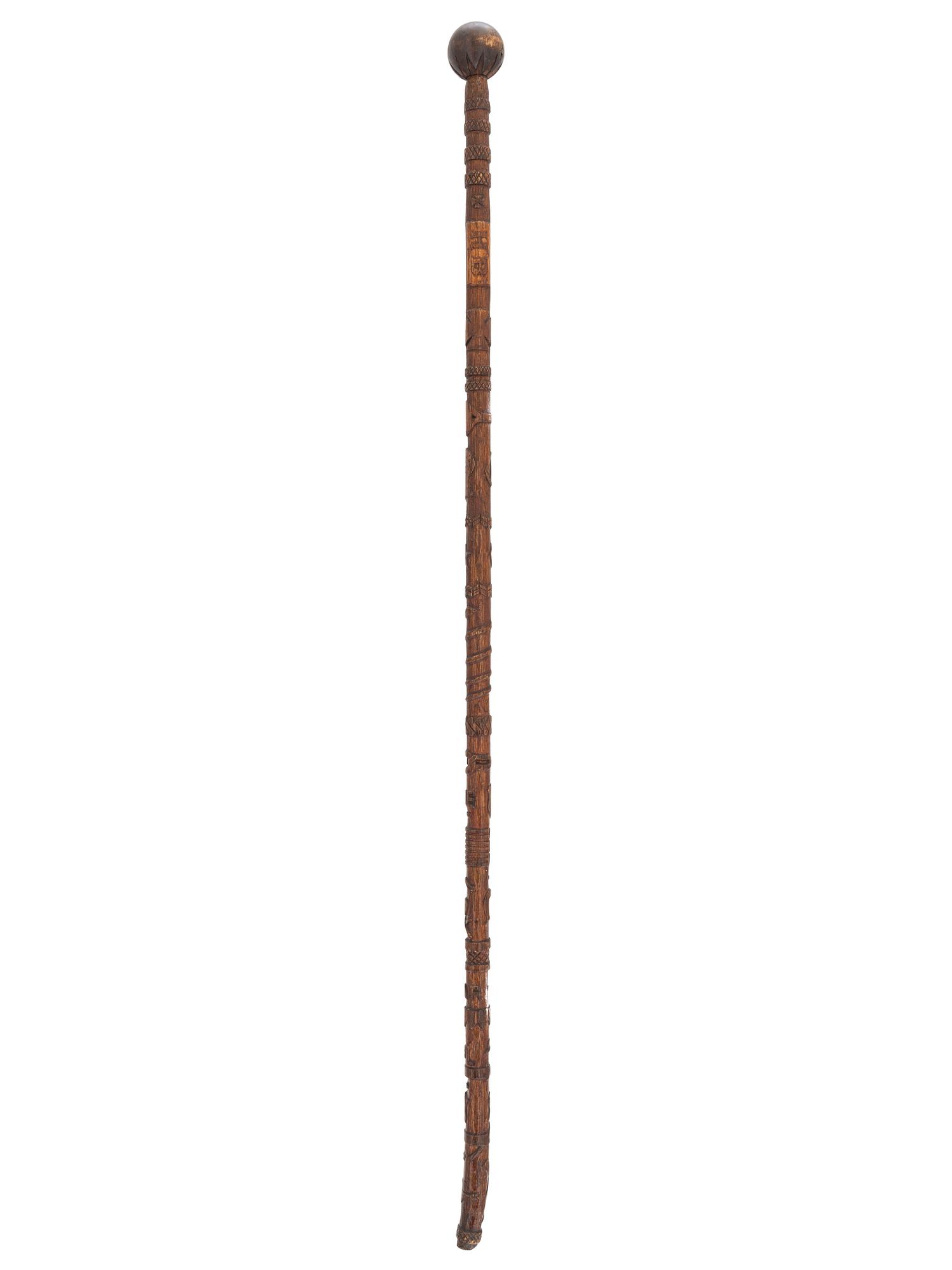 [CIVIL WAR]. GAR folk art carved cane featuring corps badges and patriotic motifs.