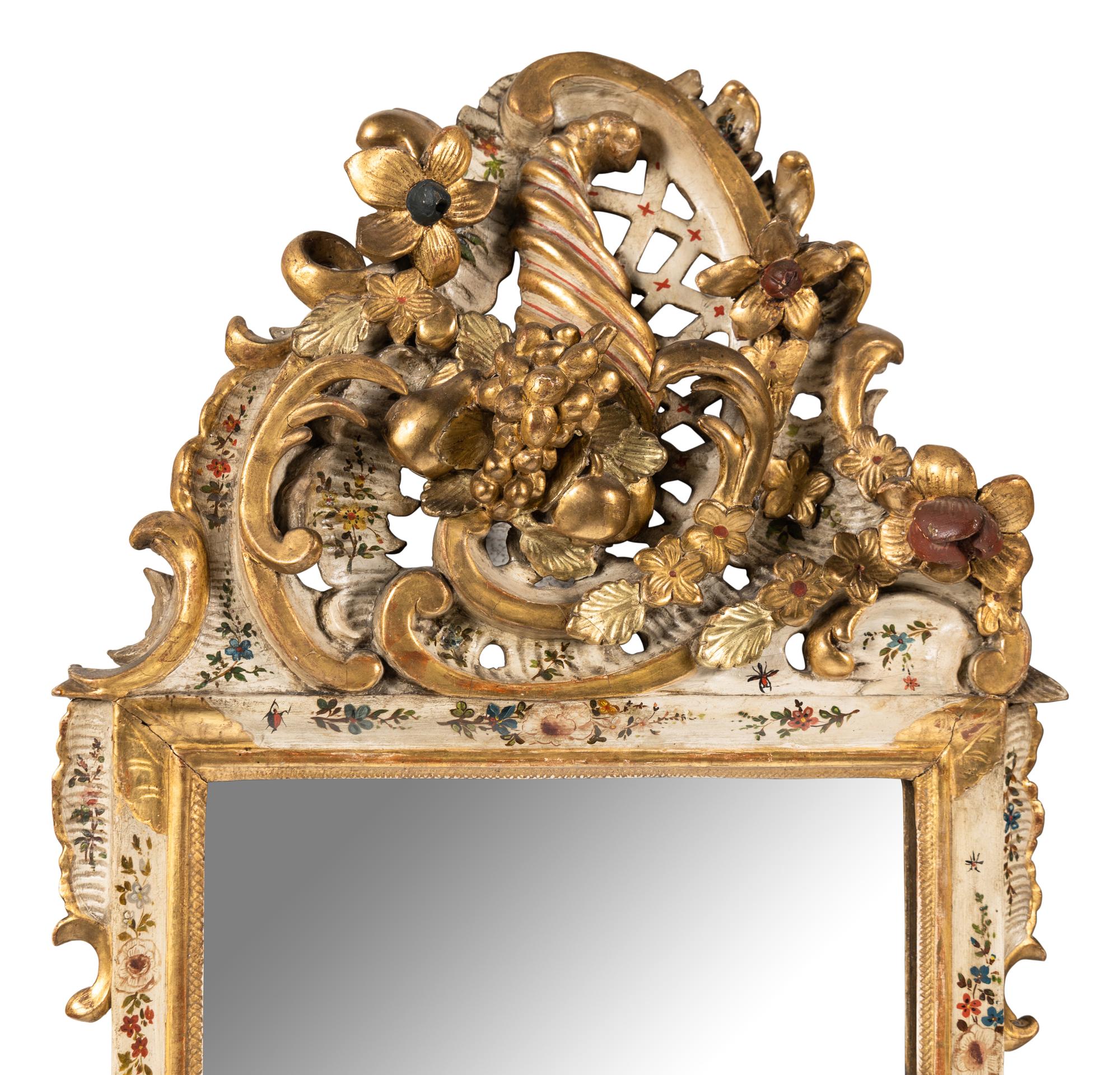 A Pair of South German Painted and Parcel Gilt Mirrors