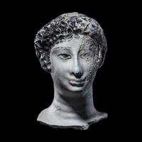 An Egyptian Painted Stucco Mummy Mask