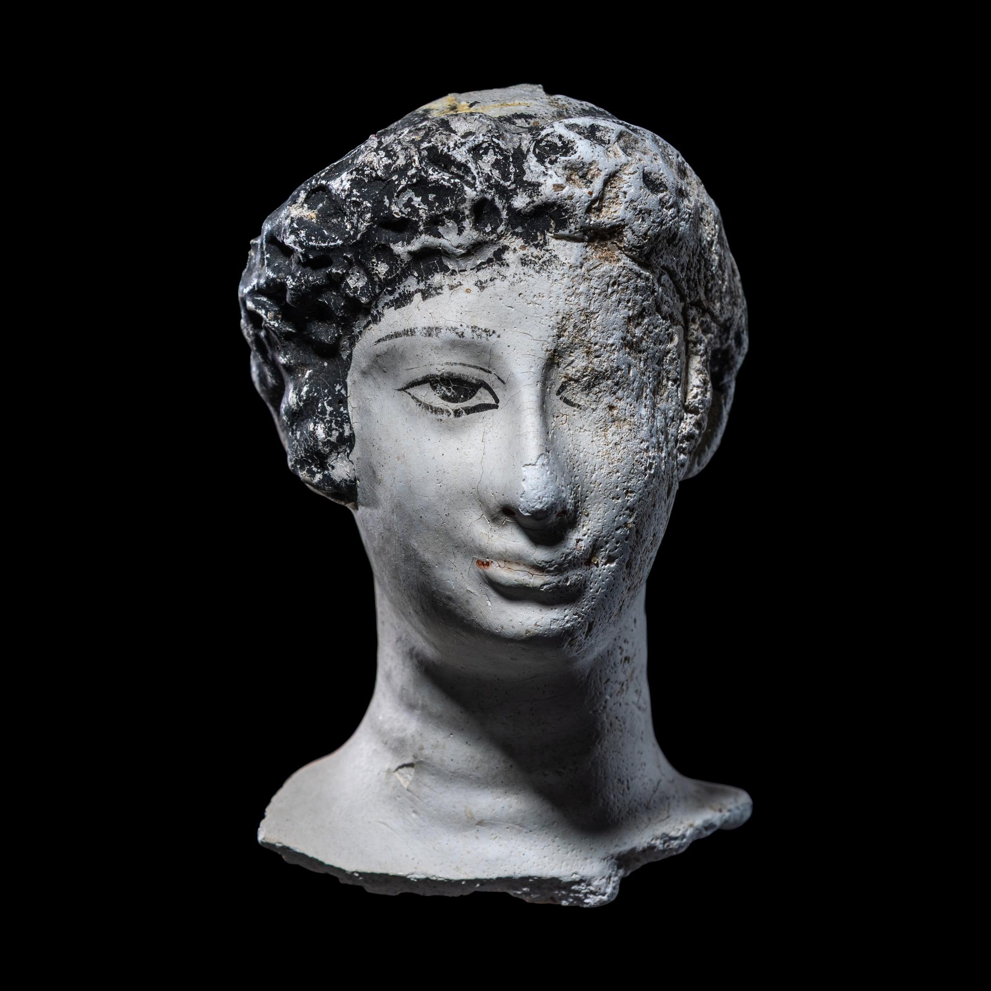 An Egyptian Painted Stucco Mummy Mask