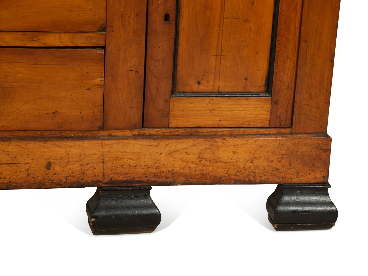 A Biedermeier Walnut and Ebony Bookcase