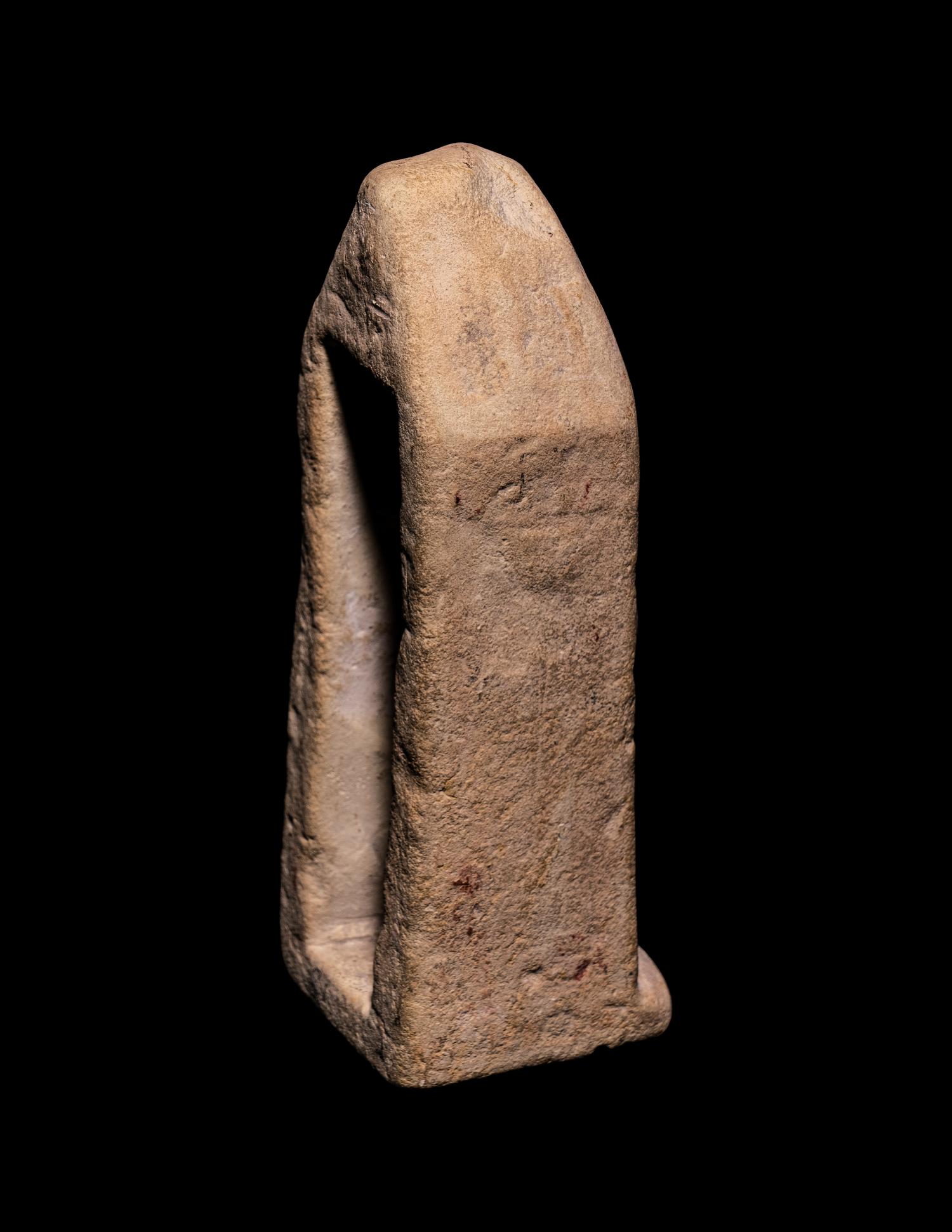 An Egyptian Limestone Case in the Form of an Obelisk with Osiris and Isis
